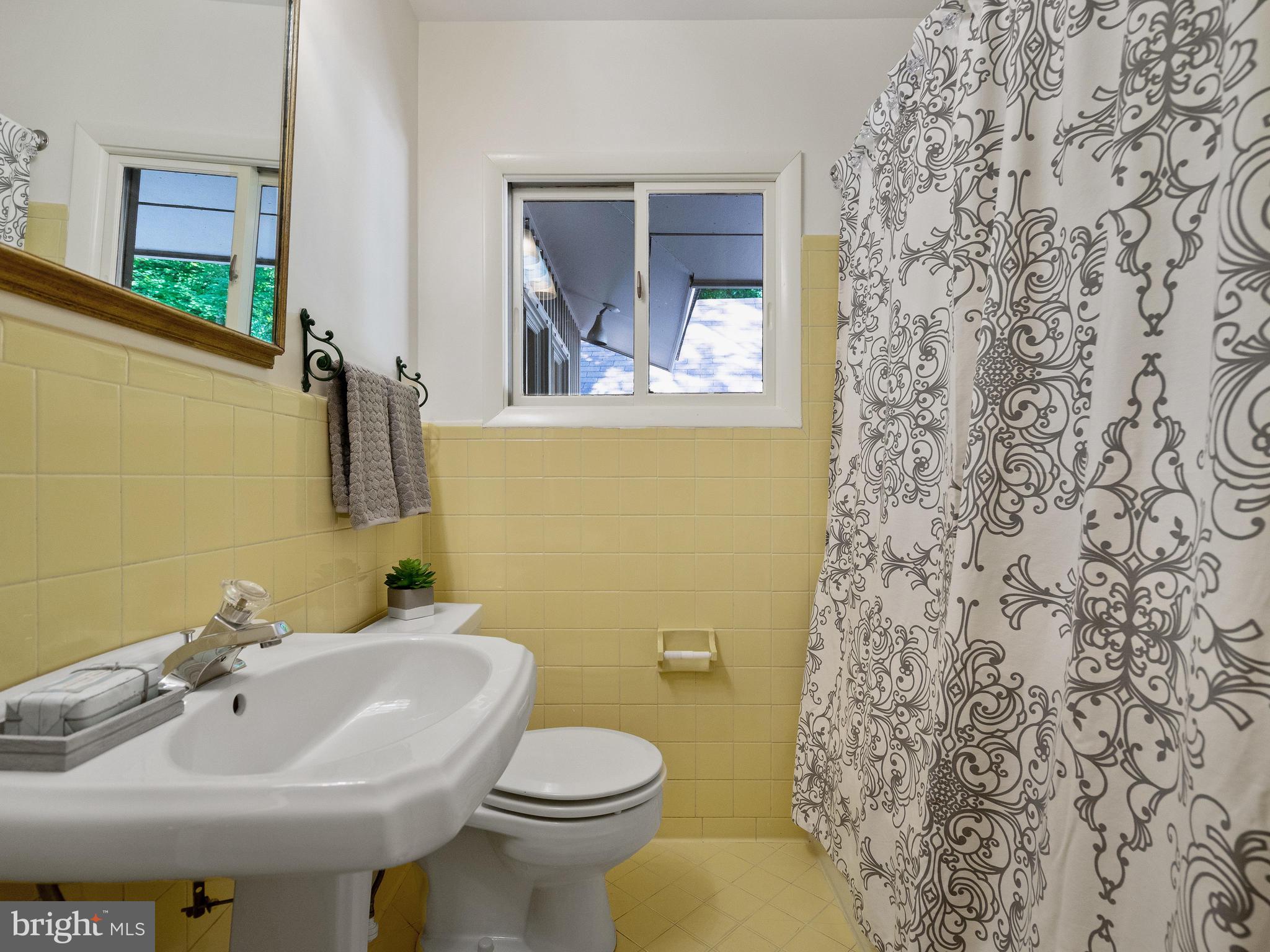 10420 Glen Road Potomac, MD 20854 - Photo 39 of 54 a bathroom with a sink and a toilet