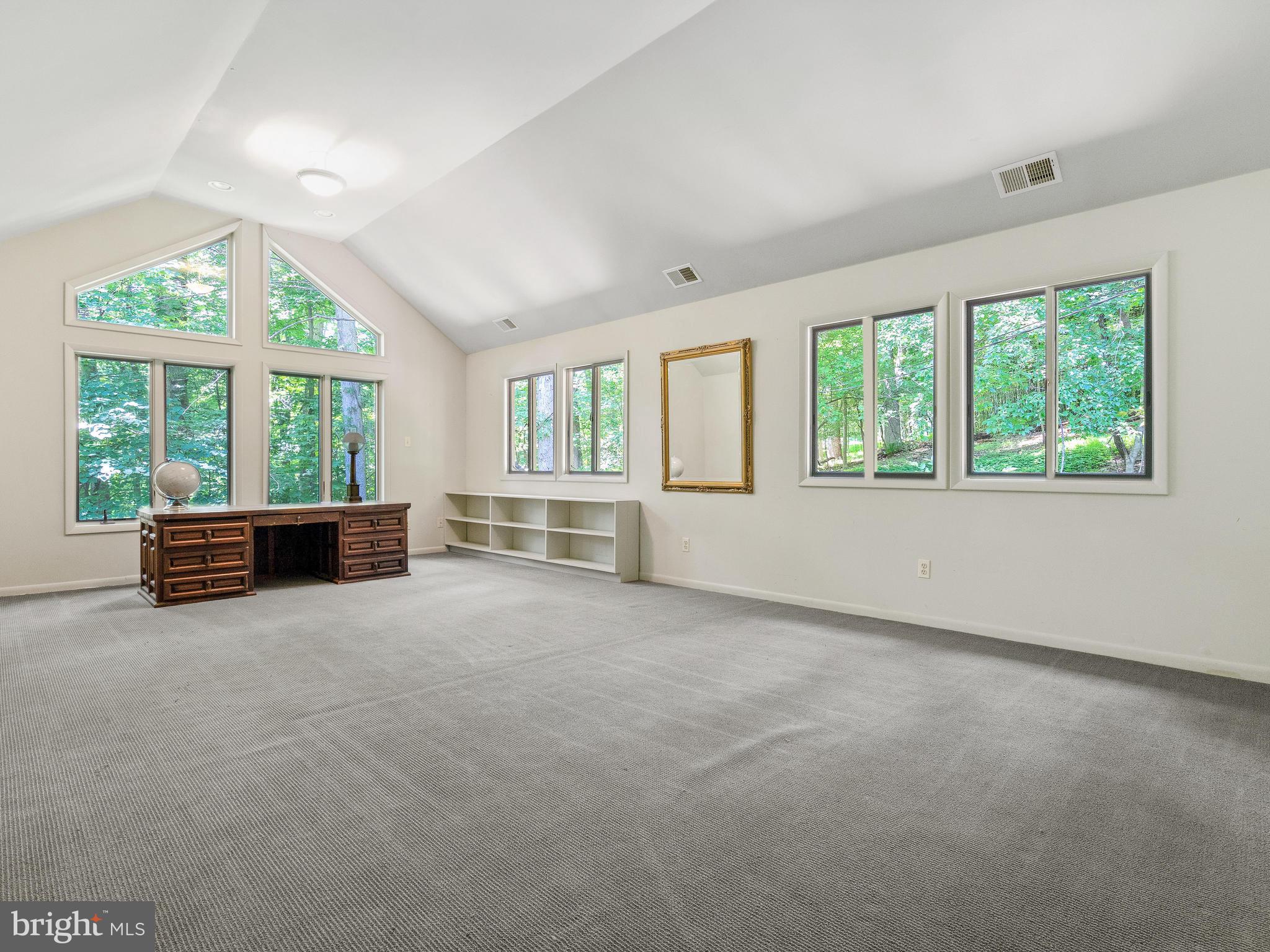 10420 Glen Road Potomac, MD 20854 - Photo 40 of 54 an empty room with furniture and windows