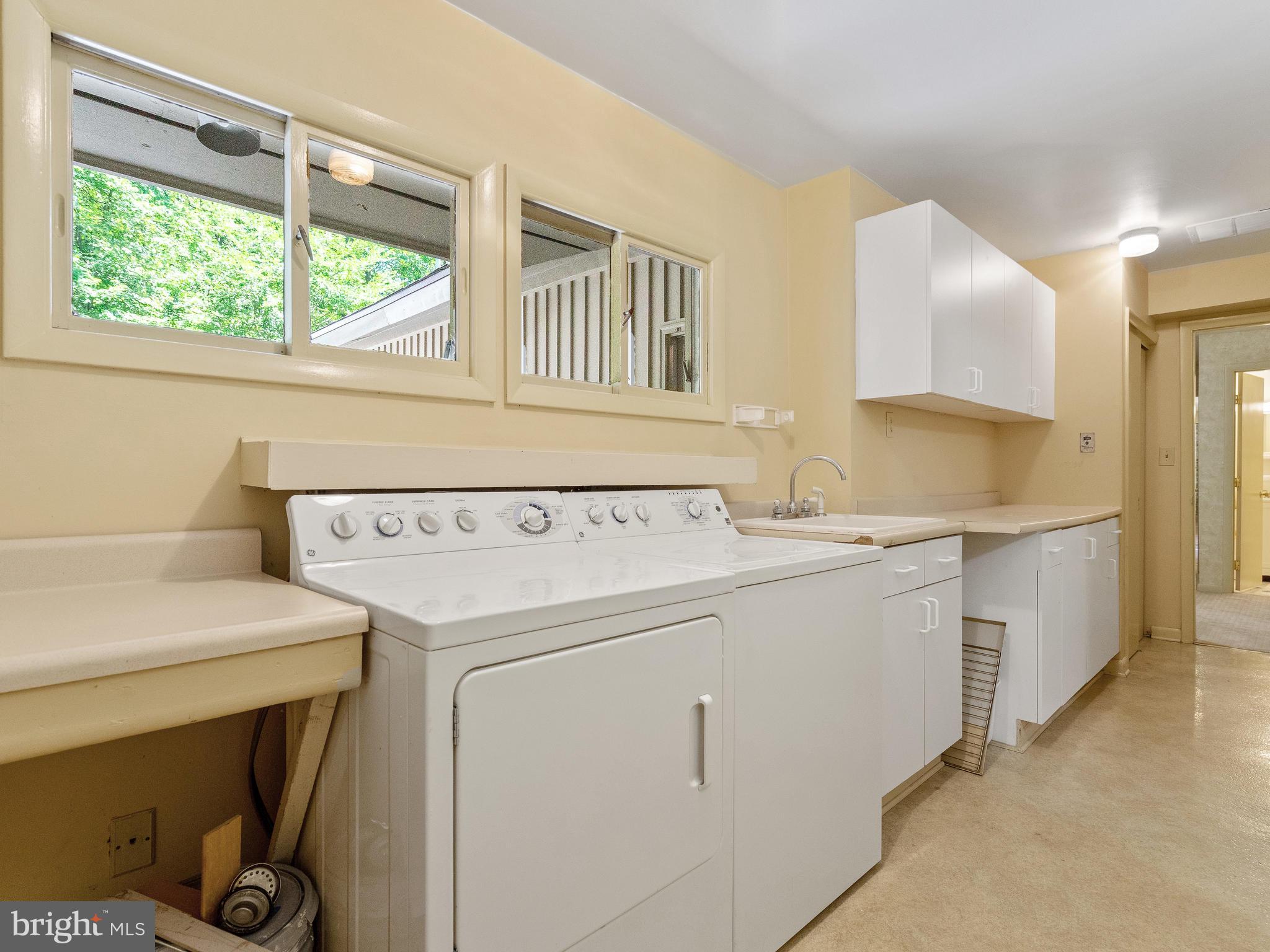 10420 Glen Road Potomac, MD 20854 - Photo 41 of 54 a utility room with dryer and washer