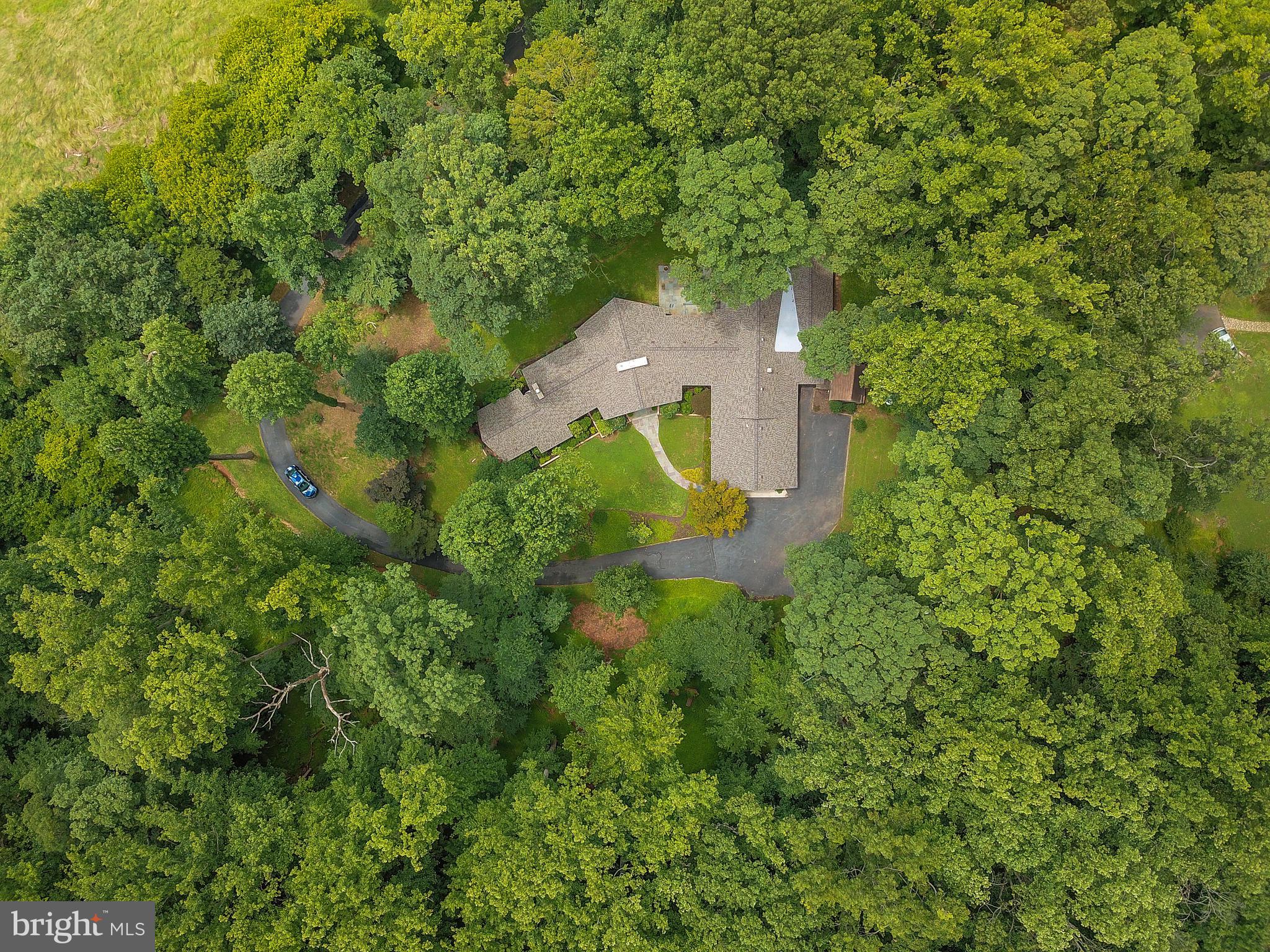 10420 Glen Road Potomac, MD 20854 - Photo 49 of 54 an aerial view of a house with a yard