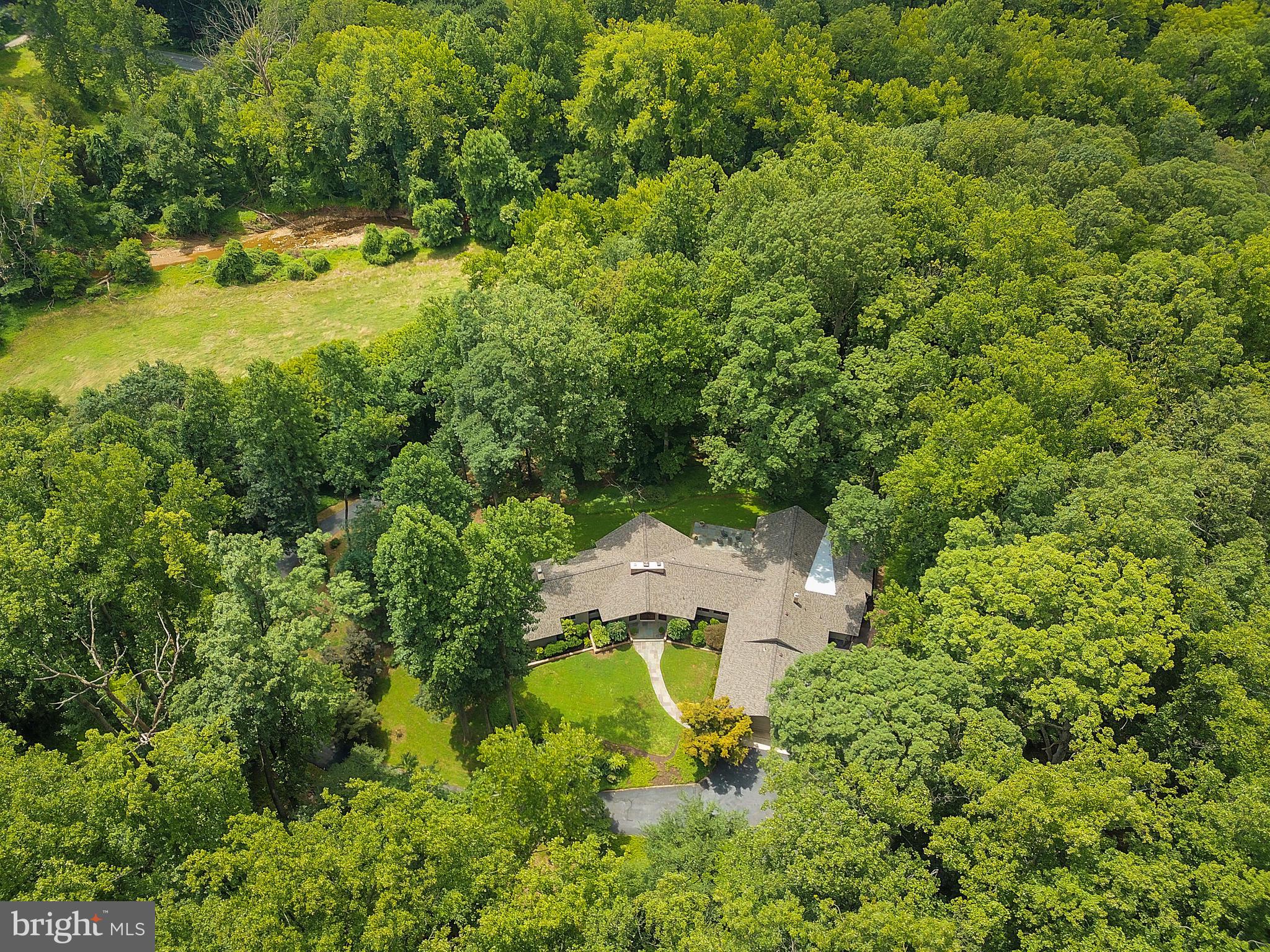 10420 Glen Road Potomac, MD 20854 - Photo 50 of 54 an aerial view of a house with a yard