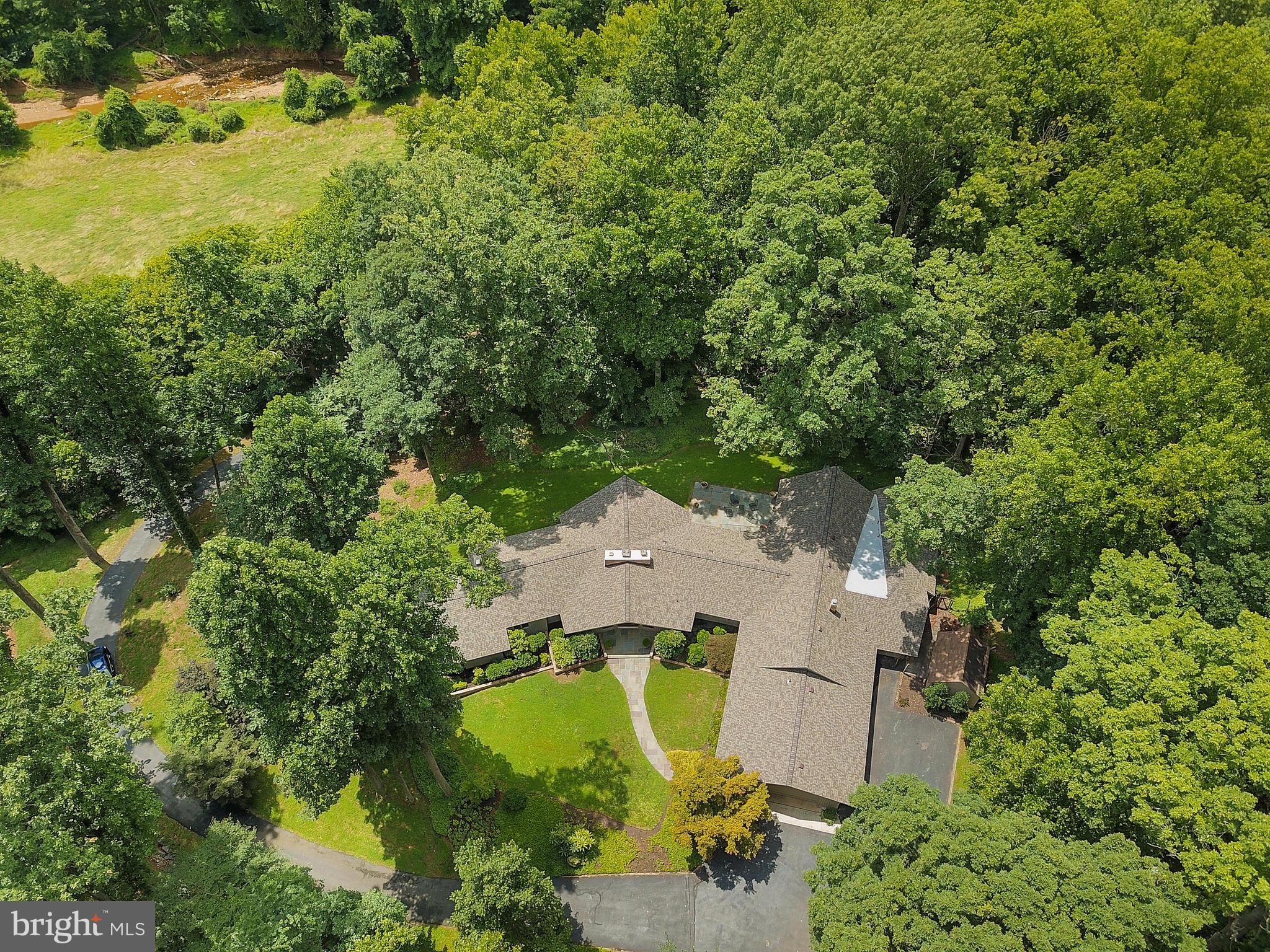 10420 Glen Road Potomac, MD 20854 - Photo 51 of 54 an aerial view of a house with a yard swimming pool and outdoor seating