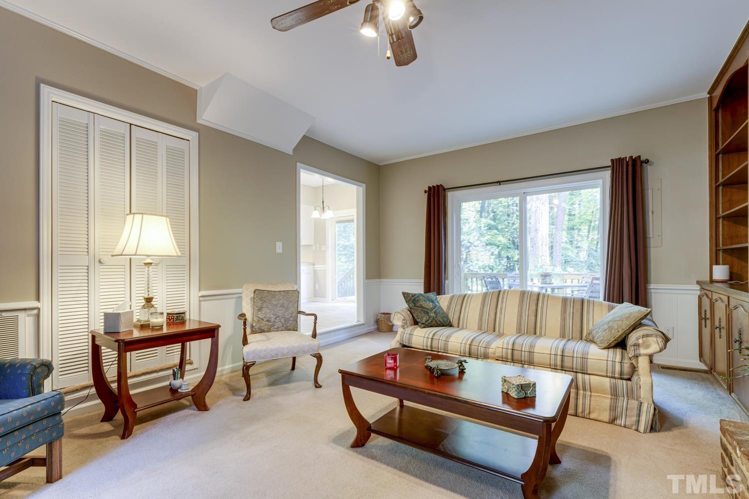 9616 Rock Creek Road Raleigh, NC 27613 - Photo 19 of 28 a living room with furniture and a large window
