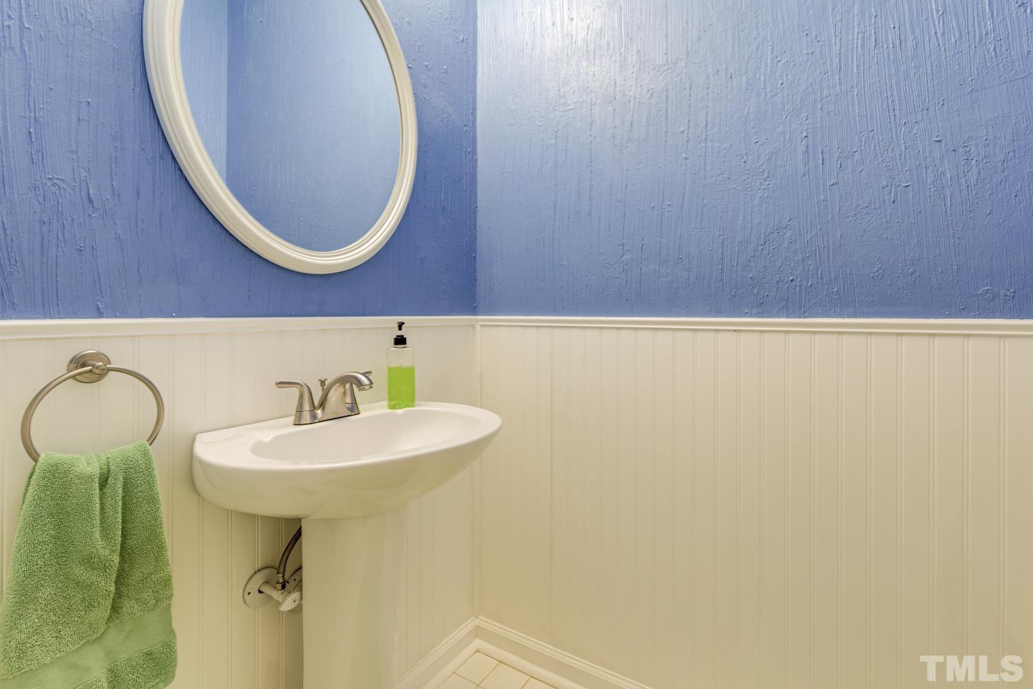 9616 Rock Creek Road Raleigh, NC 27613 - Photo 20 of 28 a bathroom with a sink and a mirror