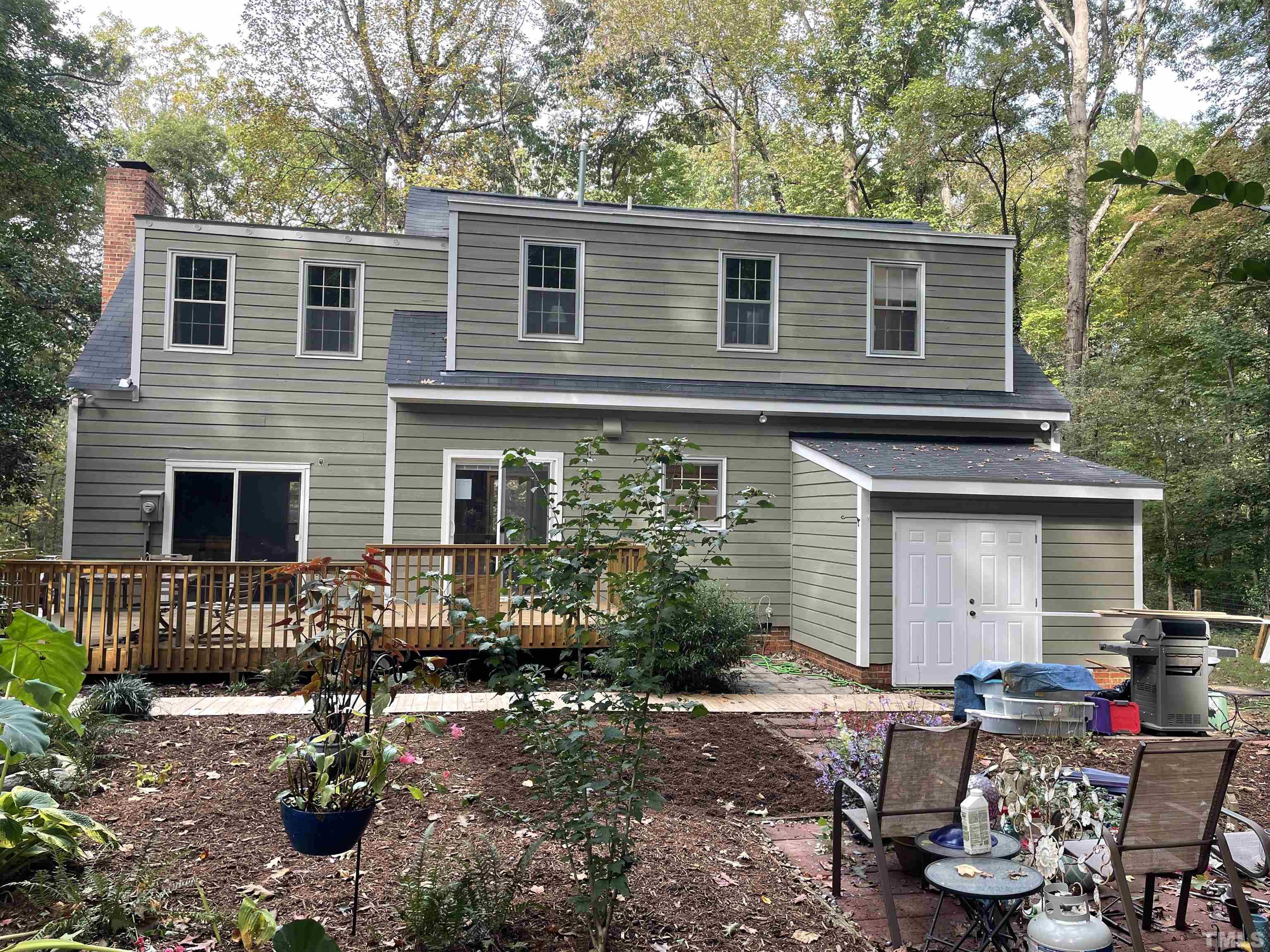 9616 Rock Creek Road Raleigh, NC 27613 - Photo 3 of 28 a front view of a house with patio