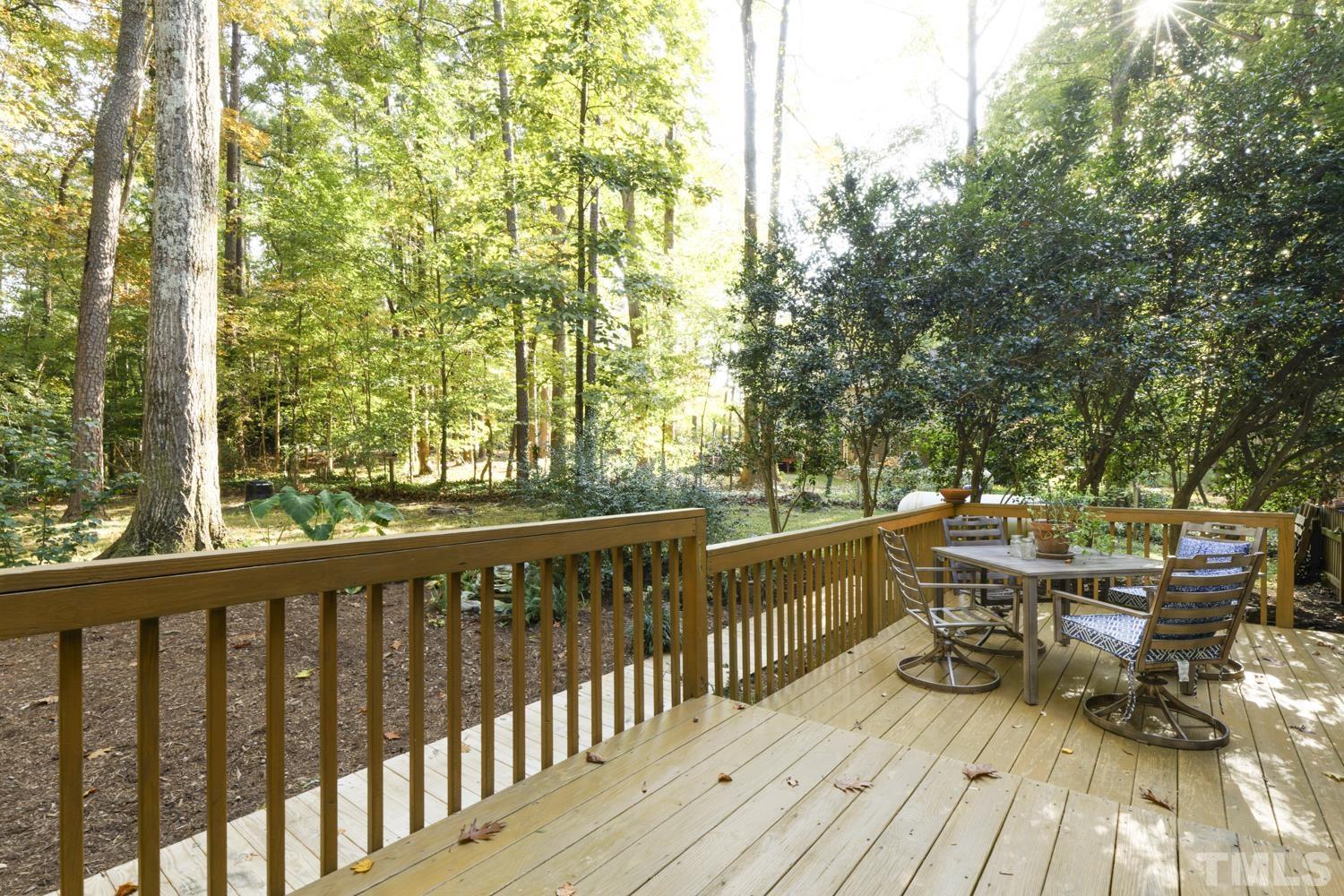 9616 Rock Creek Road Raleigh, NC 27613 - Photo 5 of 28 a view of balcony with wooden floor and outdoor seating