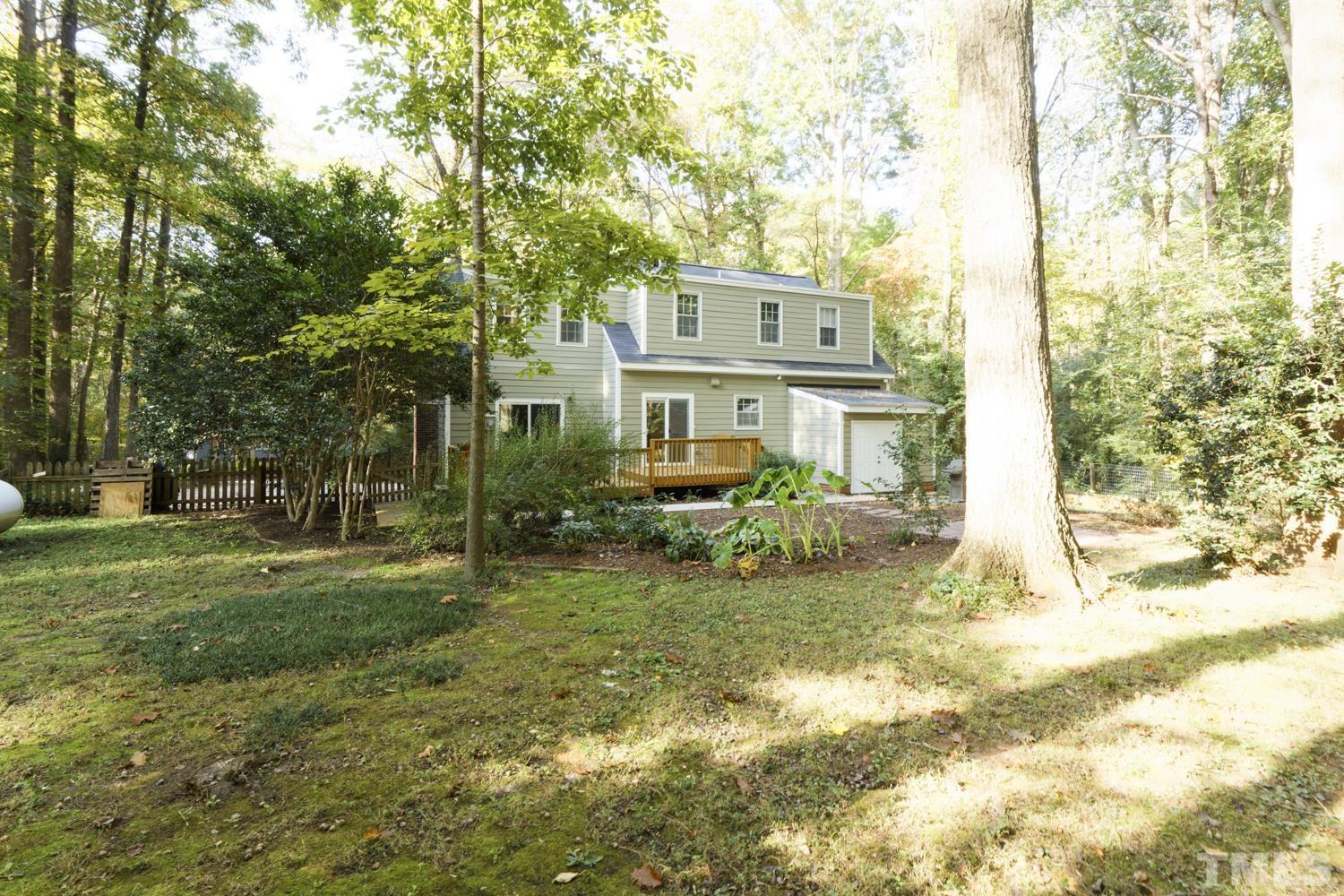 9616 Rock Creek Road Raleigh, NC 27613 - Photo 6 of 28 a view of a house with a yard