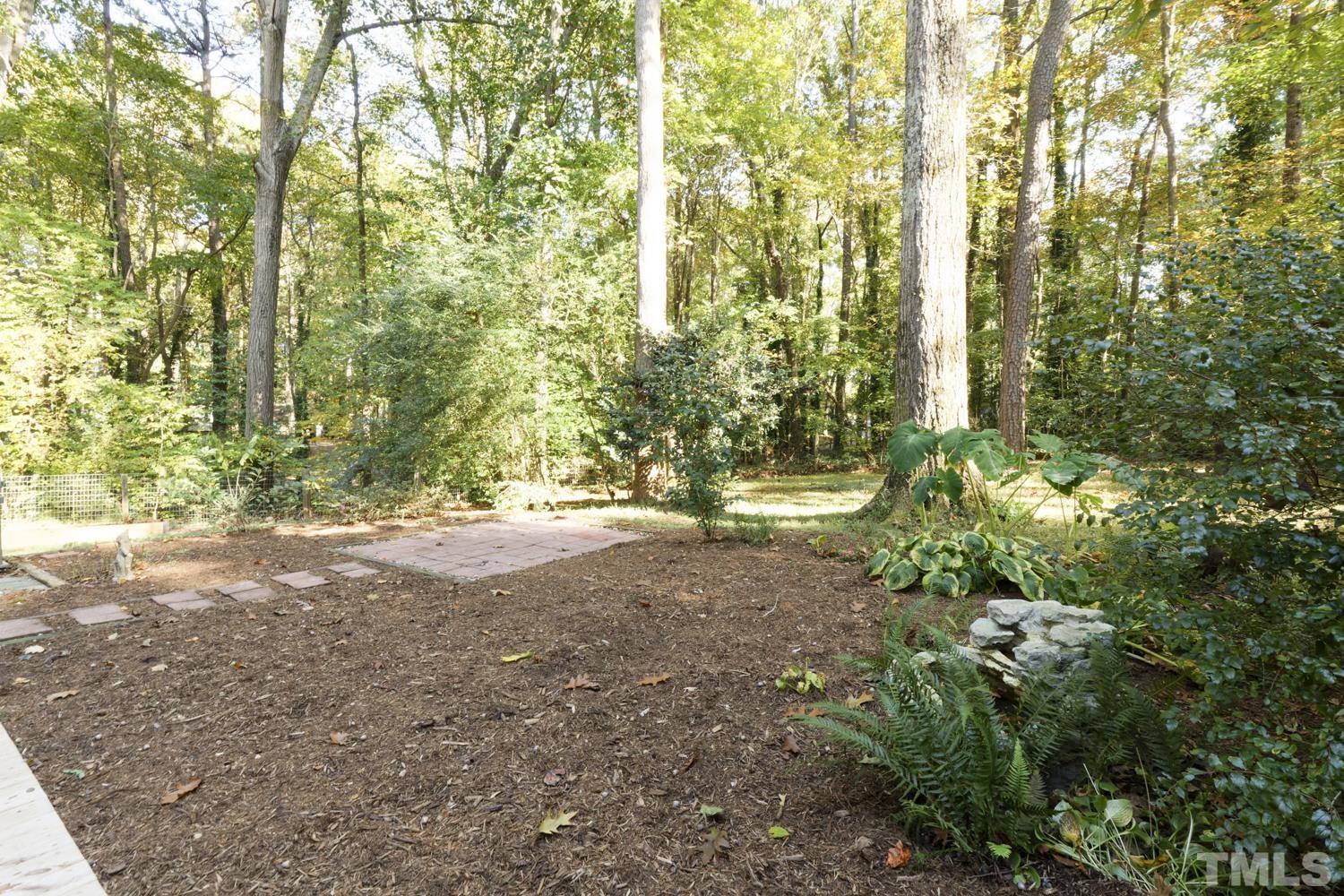 9616 Rock Creek Road Raleigh, NC 27613 - Photo 7 of 28 a view of backyard with green space
