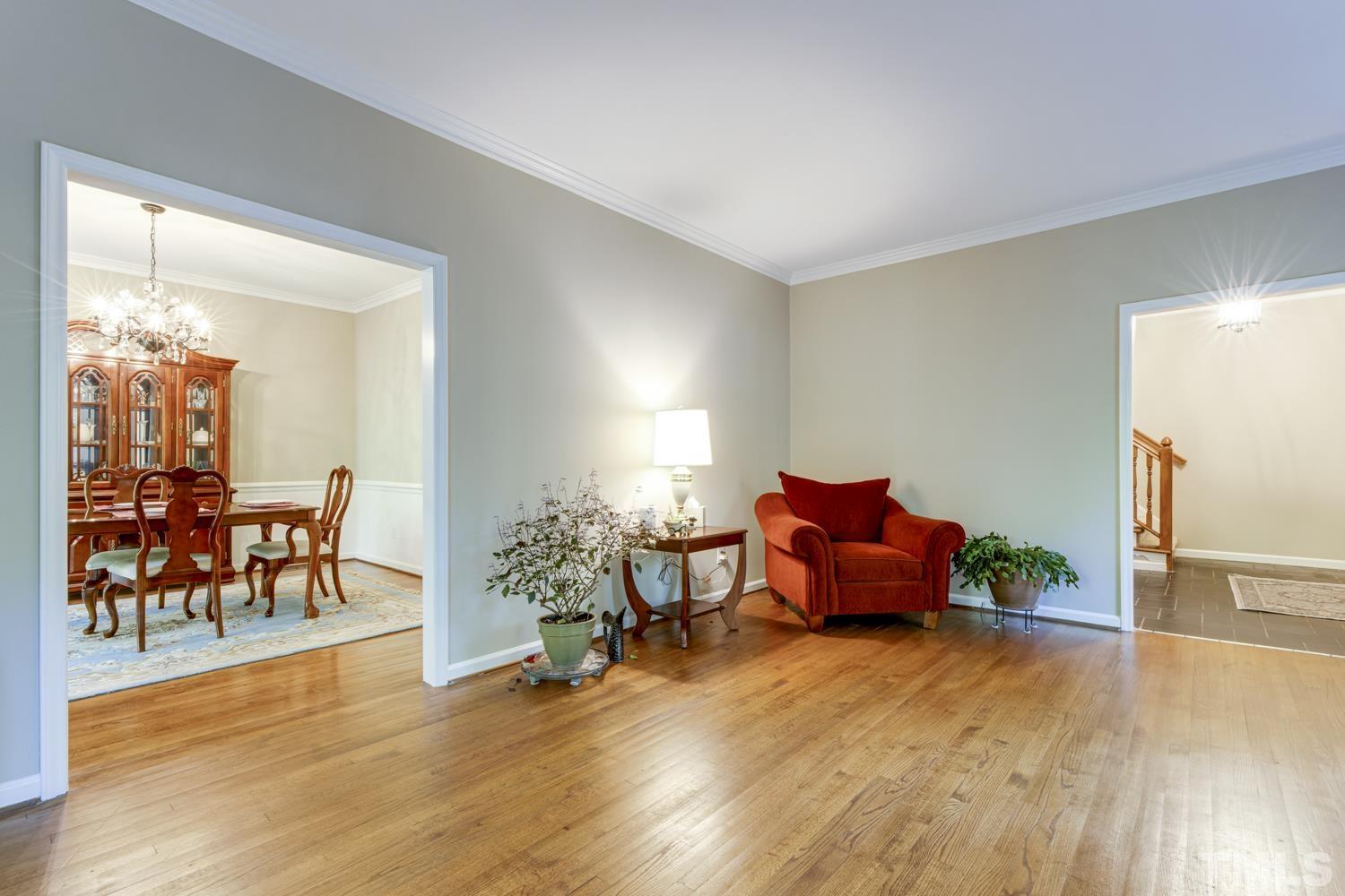 9616 Rock Creek Road Raleigh, NC 27613 - Photo 9 of 28 a living room with furniture and wooden floor