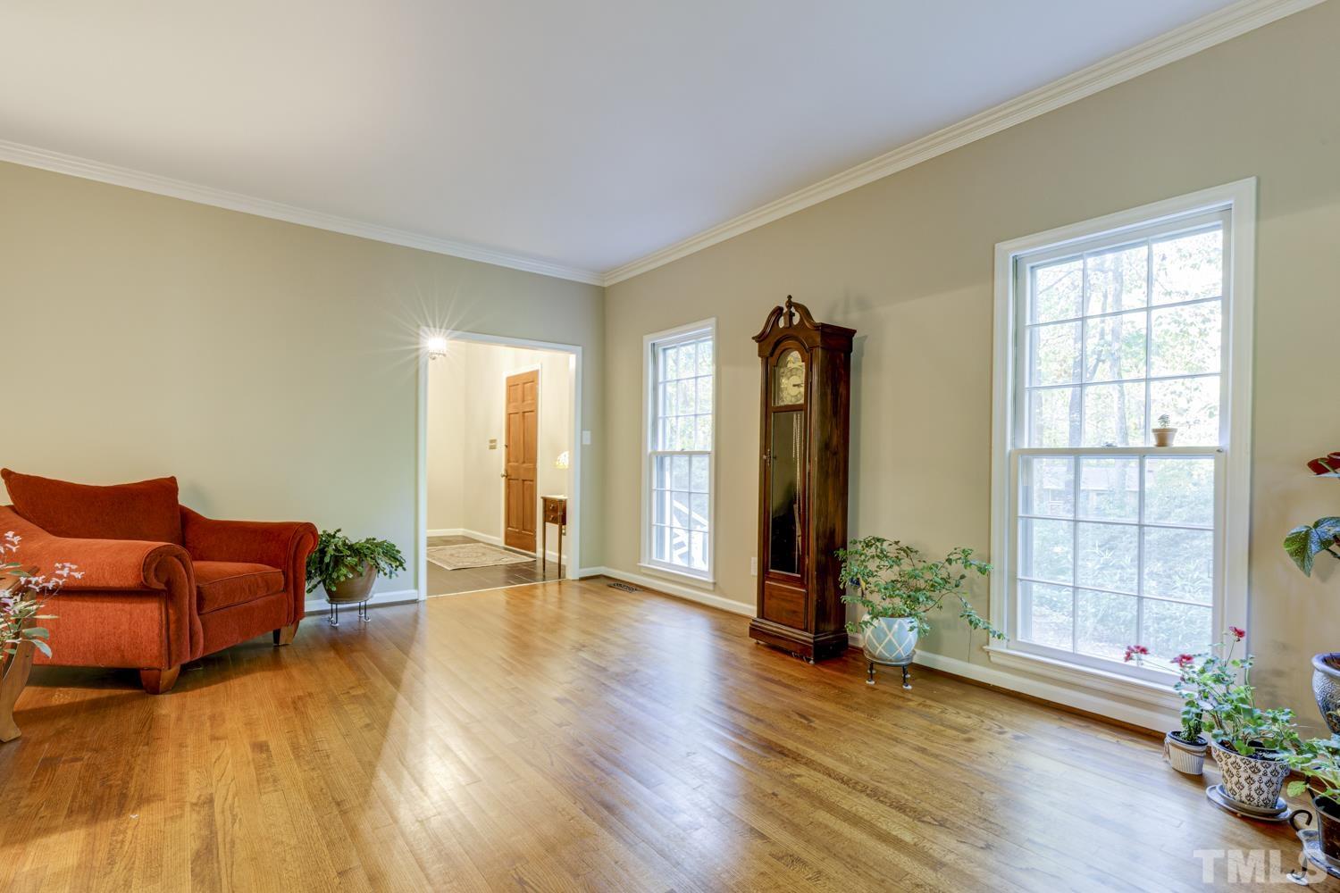 9616 Rock Creek Road Raleigh, NC 27613 - Photo 10 of 28 a living room with furniture and wooden floor