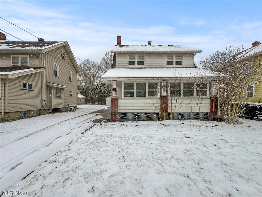 32 Como Street Struthers, OH 44471 - Photo 2 of 22 Snow covered back of property with a chimney