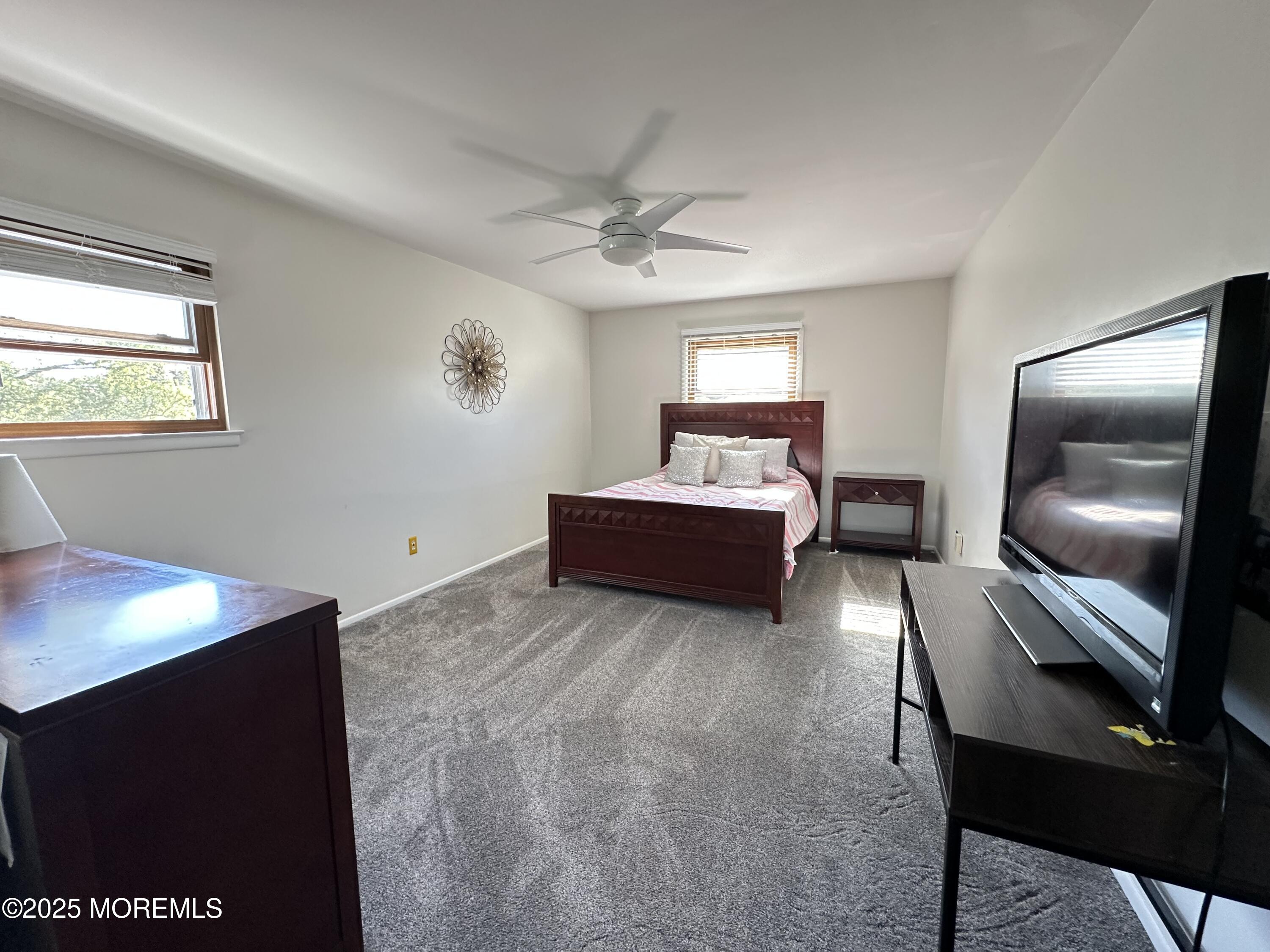 45 Springhill Drive Howell, NJ 07731 - Photo 11 of 22 a living room with furniture and a flat screen tv
