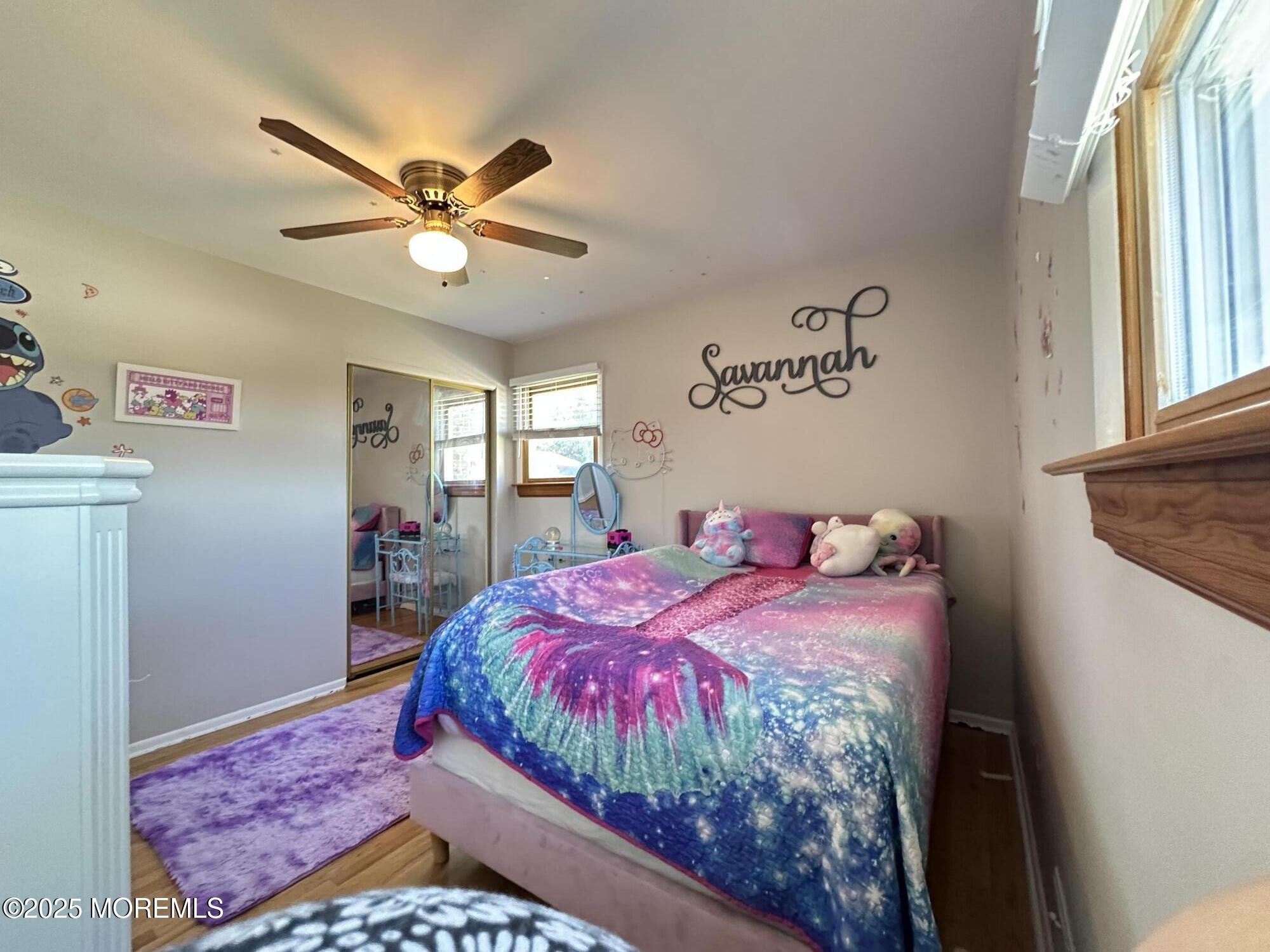 45 Springhill Drive Howell, NJ 07731 - Photo 13 of 22 a bedroom with a bed and a chandelier
