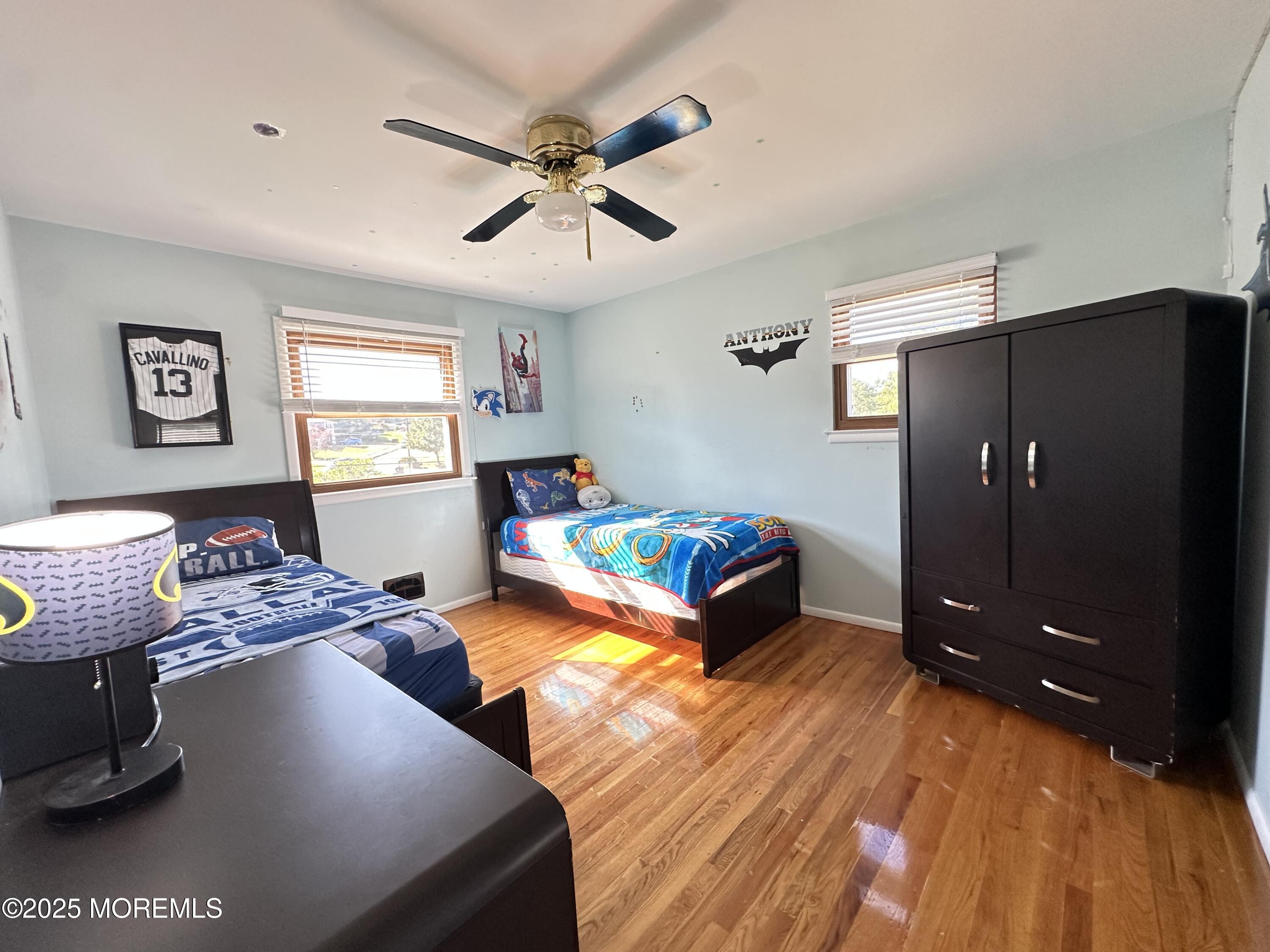 45 Springhill Drive Howell, NJ 07731 - Photo 14 of 22 a bedroom with a bed and wooden floor