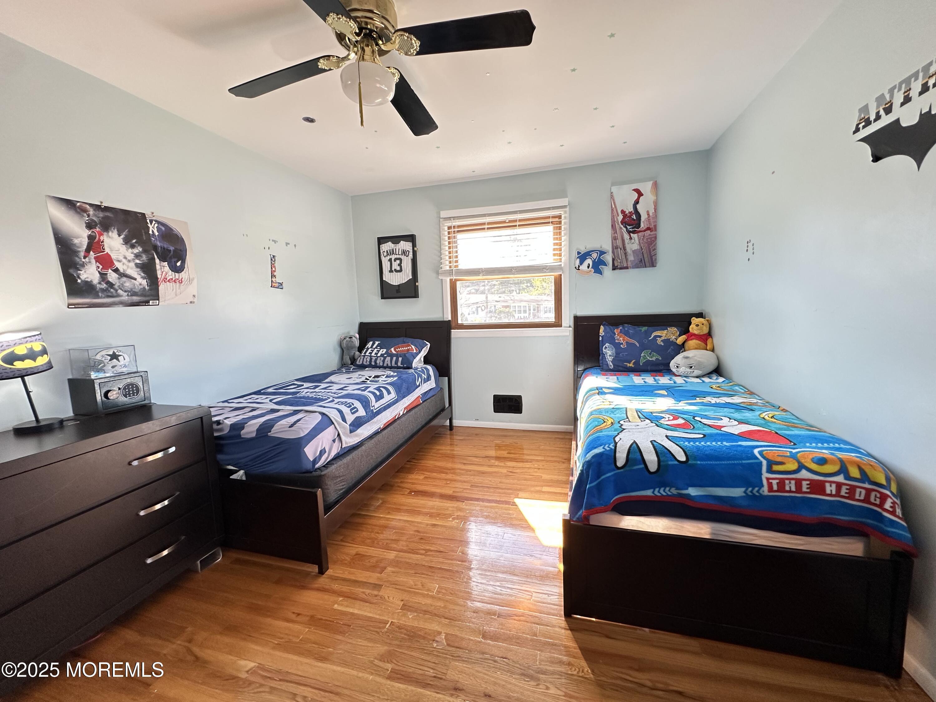 45 Springhill Drive Howell, NJ 07731 - Photo 15 of 22 a bedroom with a bed and a chandelier