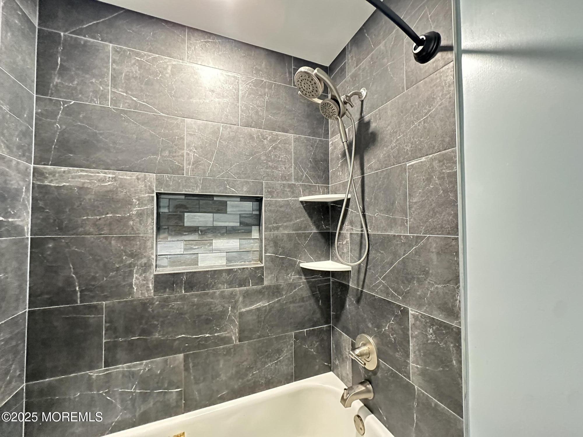 45 Springhill Drive Howell, NJ 07731 - Photo 16 of 22 a bathroom with a shower and mirror