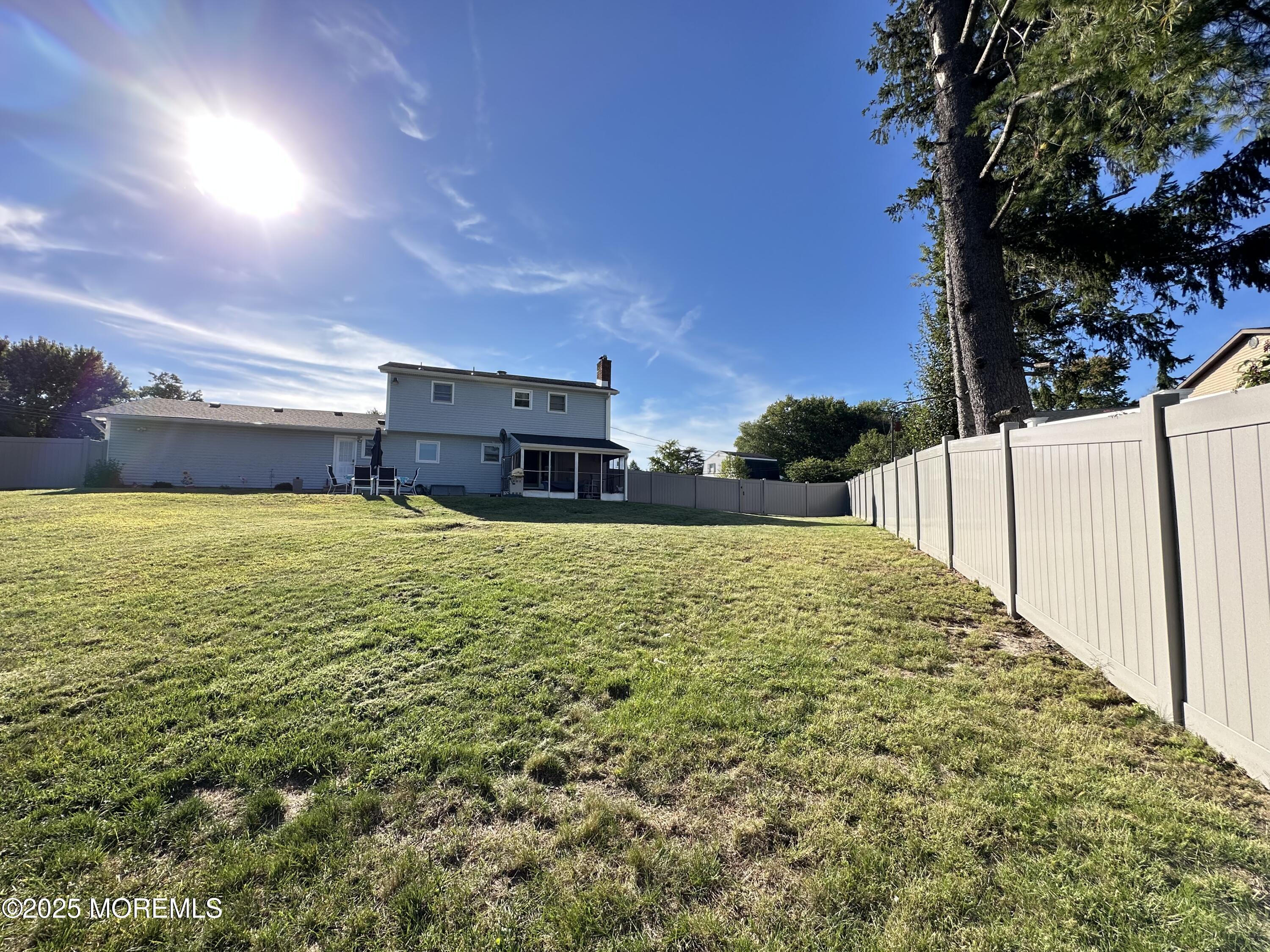 45 Springhill Drive Howell, NJ 07731 - Photo 21 of 22 a view of a pool with an outdoor space and seating area
