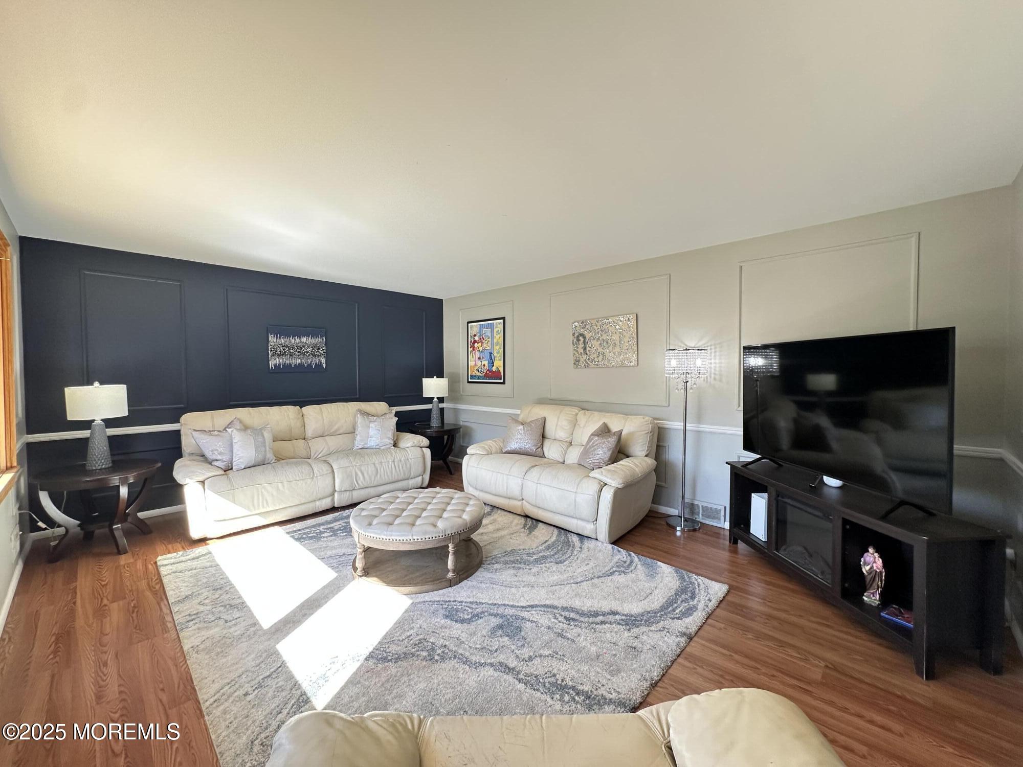 45 Springhill Drive Howell, NJ 07731 - Photo 3 of 22 a living room with furniture and a flat screen tv