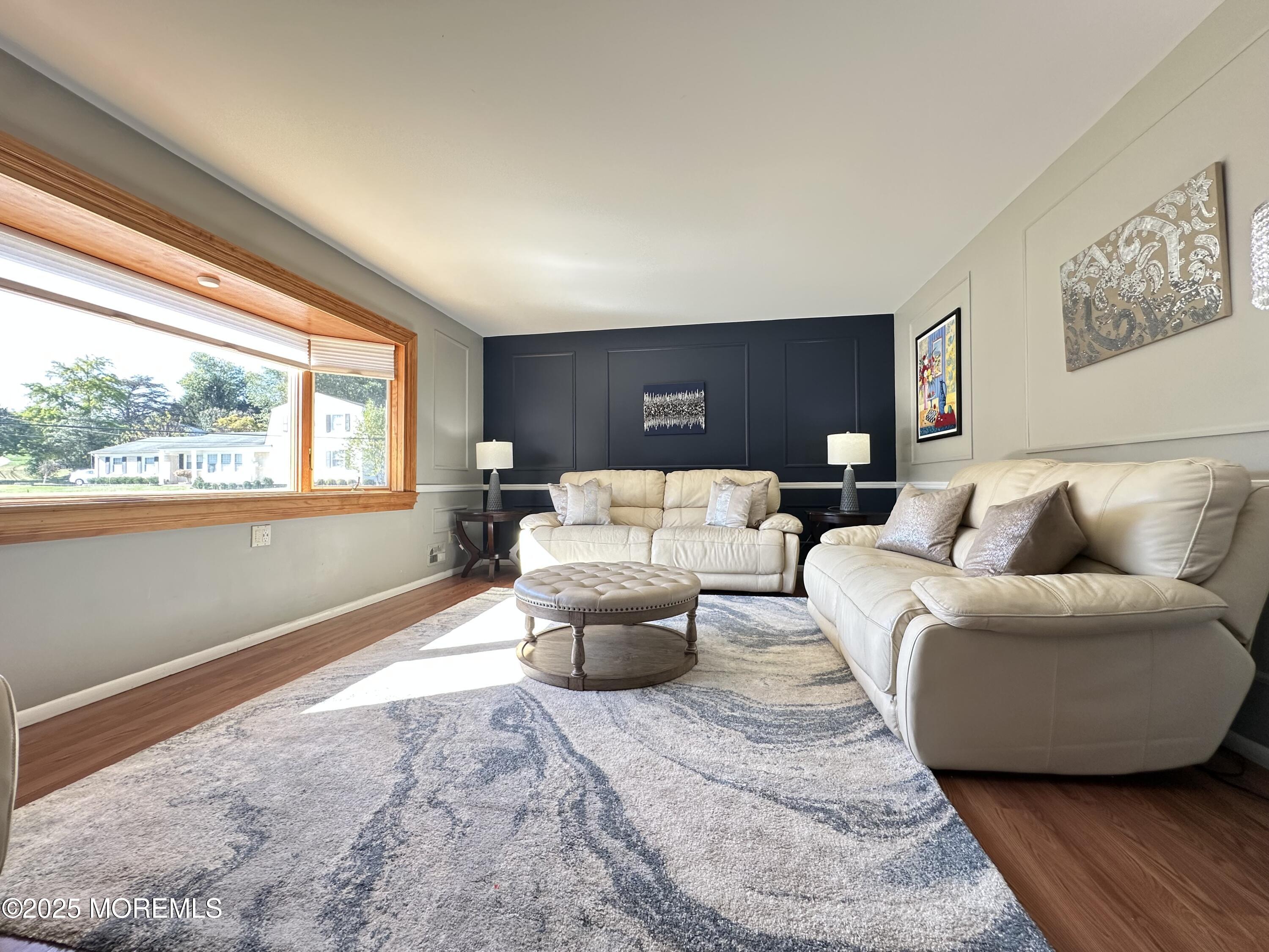 45 Springhill Drive Howell, NJ 07731 - Photo 4 of 22 a living room with furniture and a large window