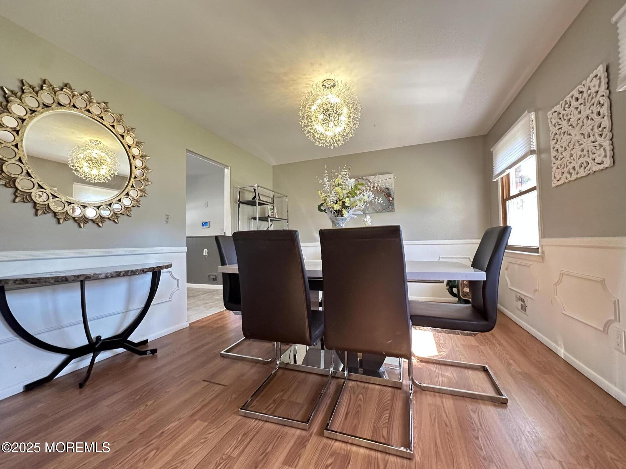 45 Springhill Drive Howell, NJ 07731 - Photo 5 of 22 a view of a dining room with furniture and wooden floor