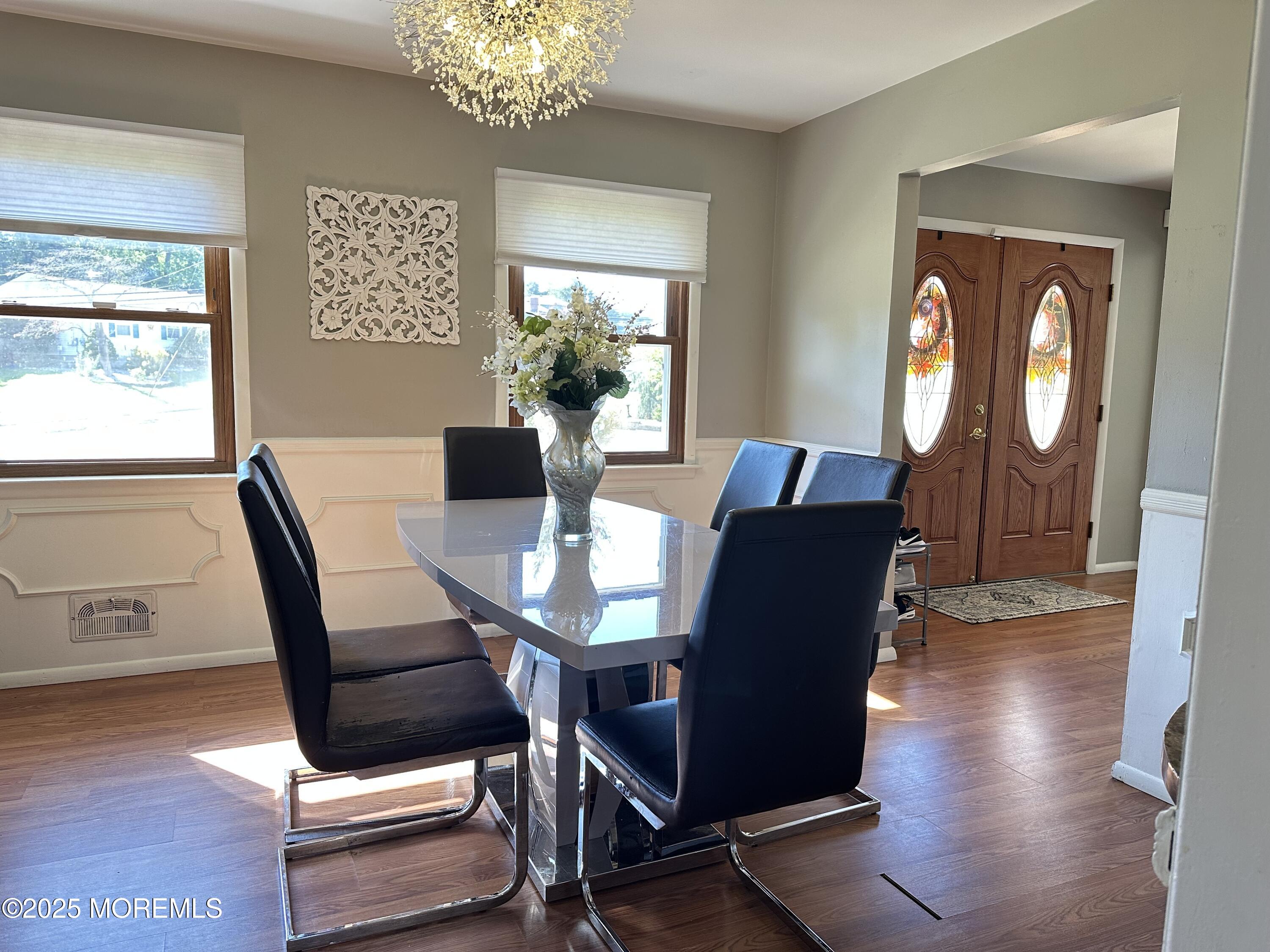 45 Springhill Drive Howell, NJ 07731 - Photo 6 of 22 a view of a dining room with furniture window and wooden floor