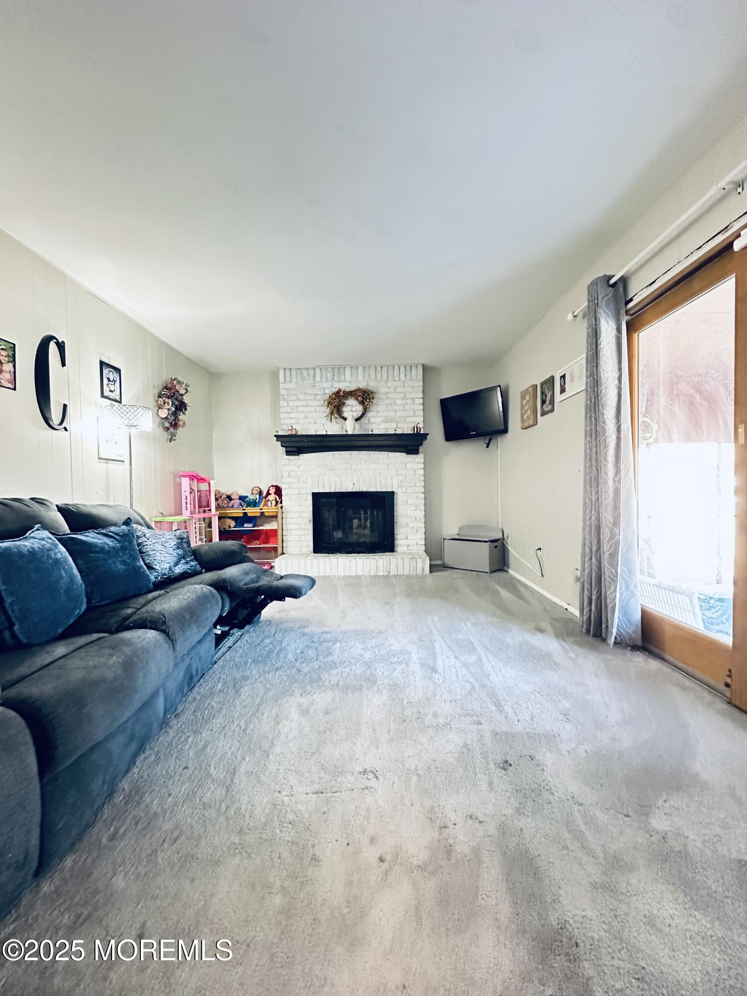 45 Springhill Drive Howell, NJ 07731 - Photo 10 of 22 a living room with furniture a window and a fireplace