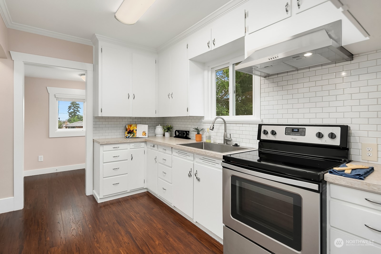 3515 Southwest Austin Street Seattle, WA 98126 - Photo 10 of 35 a kitchen with cabinets appliances and a wooden floor