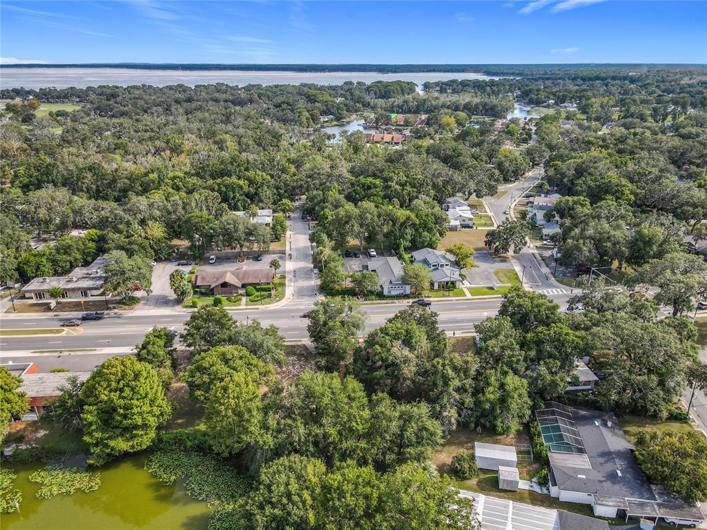 1024 West Dixie Avenue Leesburg, FL 34748 - Photo 18 of 23 an aerial view of a city with lots of residential buildings ocean and mountain view in back