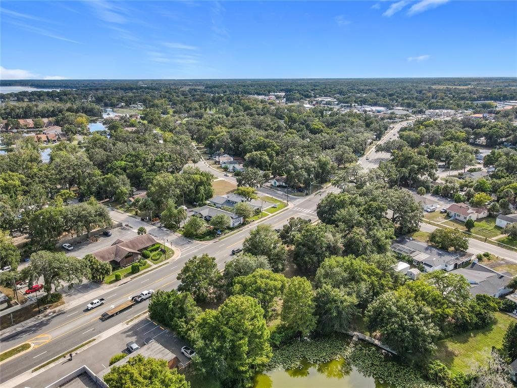 1024 West Dixie Avenue Leesburg, FL 34748 - Photo 19 of 23 an aerial view of residential houses with outdoor space and trees