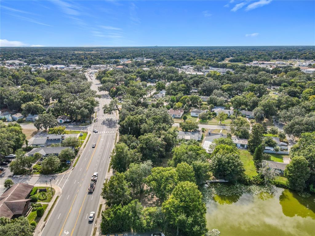1024 West Dixie Avenue Leesburg, FL 34748 - Photo 20 of 23 an aerial view of residential houses with outdoor space and trees