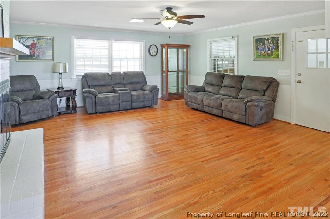 2136 Alderman Mill Road Dunn, NC 28334 - Photo 16 of 28 a living room with furniture and a flat screen tv