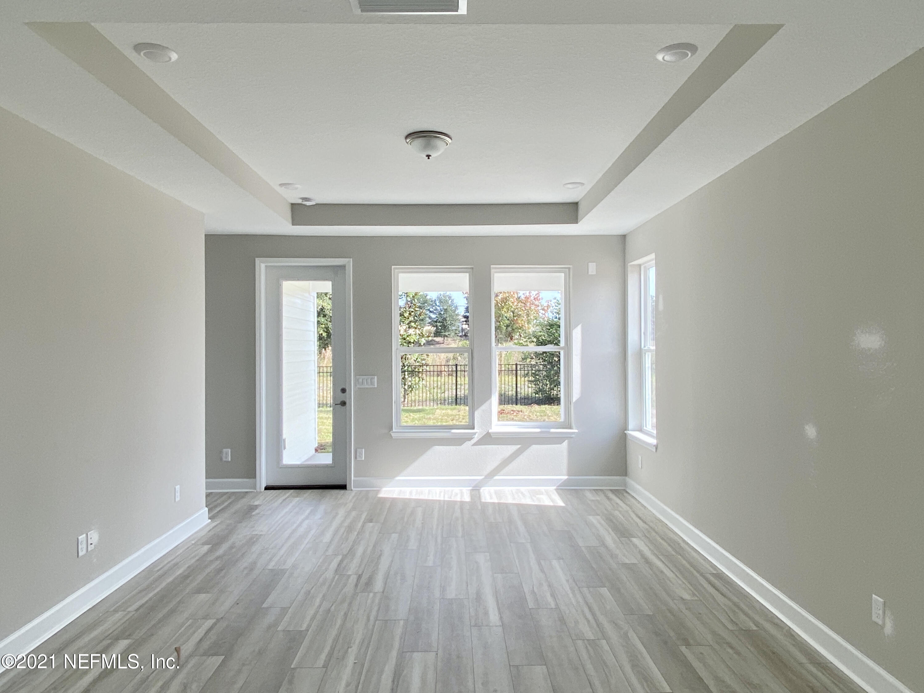 1055 Rustic Mill Dr Street St. Augustine, FL 32092 - Photo 2 of 39 wooden floor in an empty room with a window