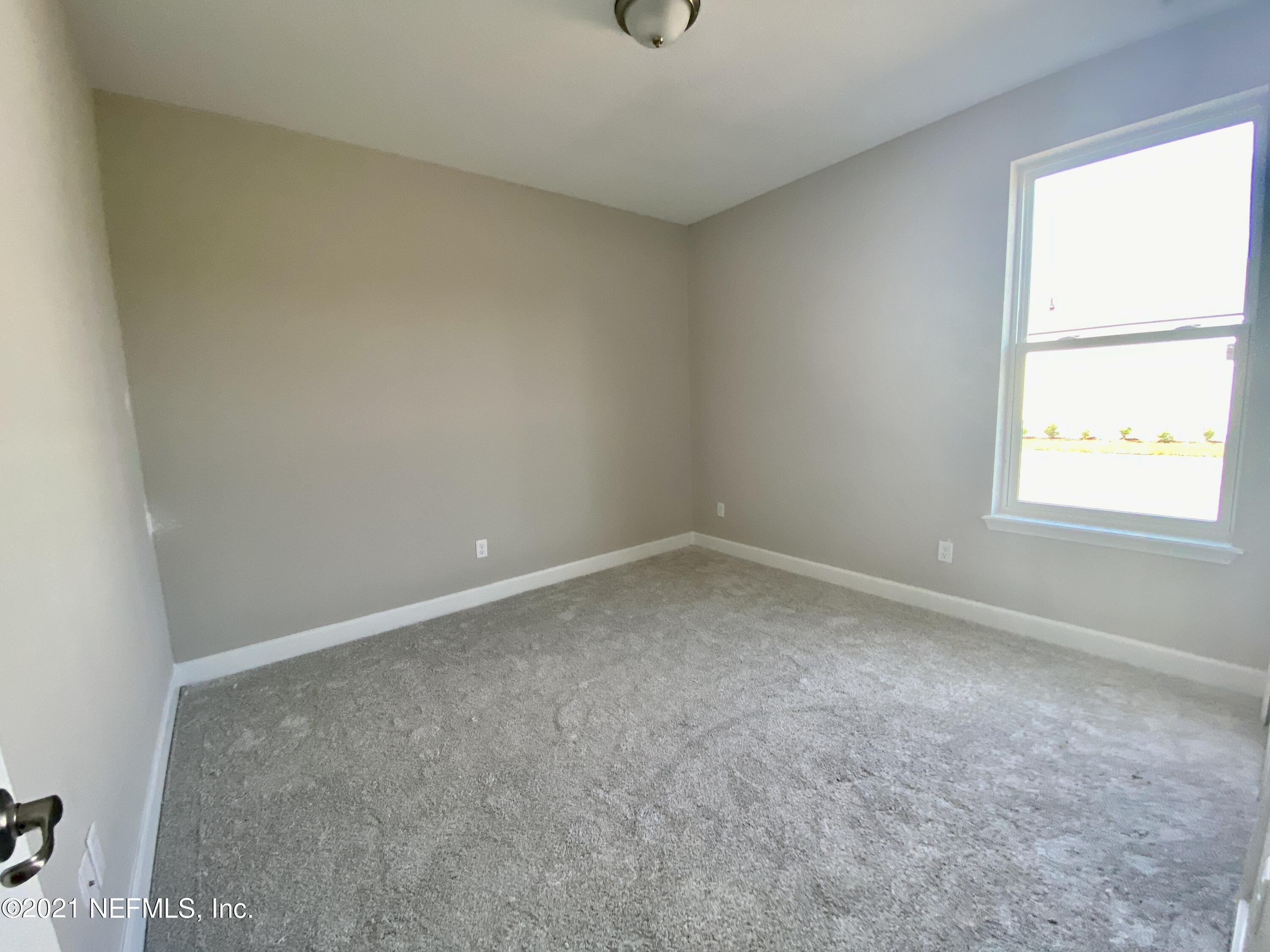 1055 Rustic Mill Dr Street St. Augustine, FL 32092 - Photo 7 of 39 an empty room with a window