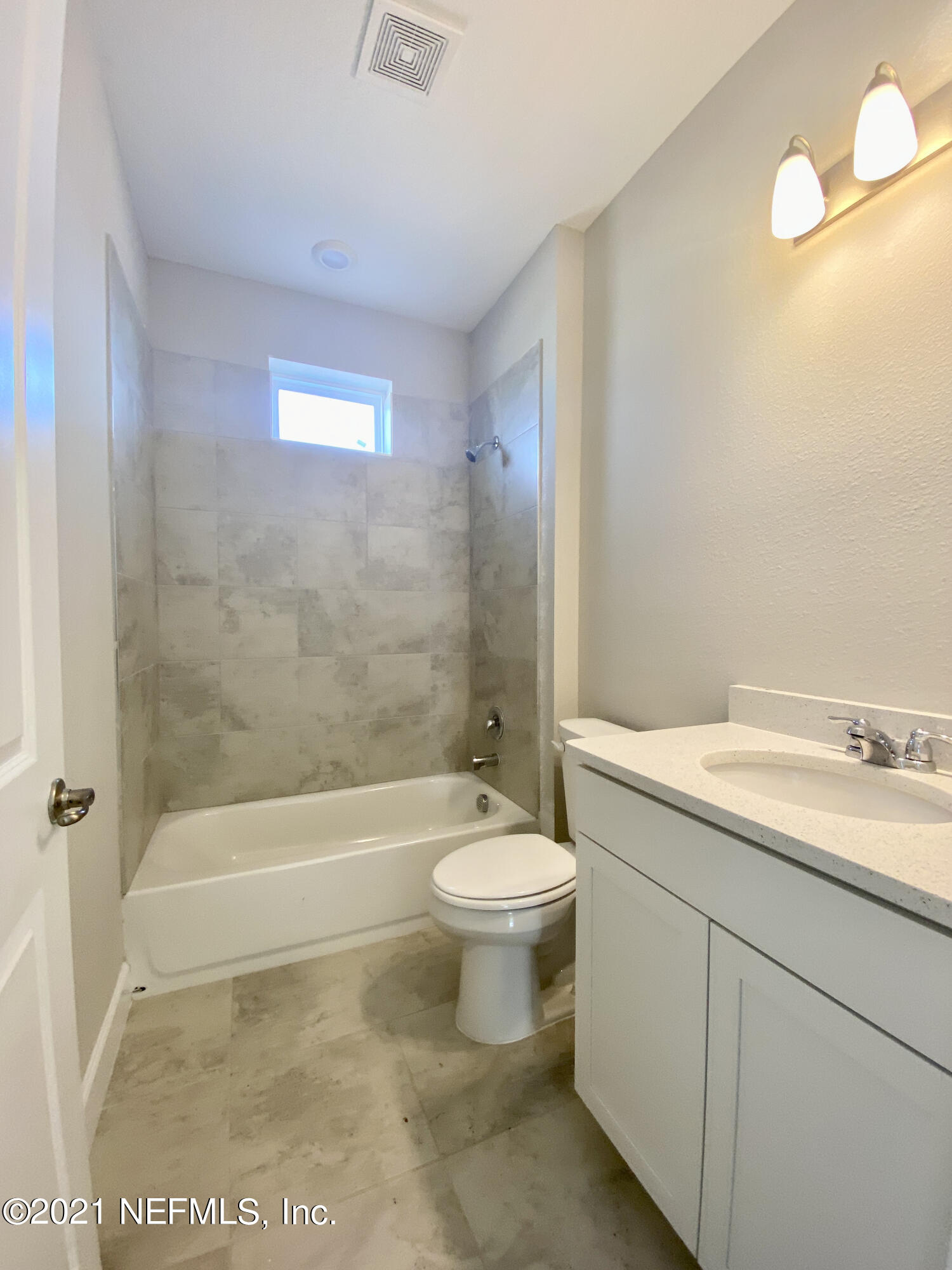 1055 Rustic Mill Dr Street St. Augustine, FL 32092 - Photo 8 of 39 a bathroom with a granite countertop toilet a sink and bathtub