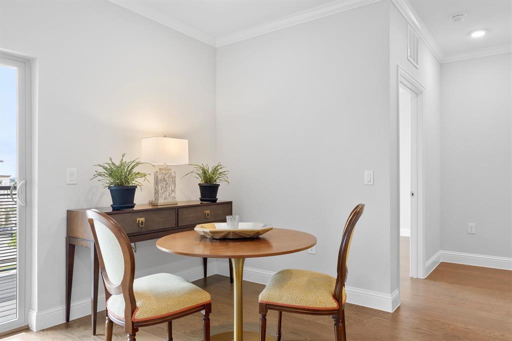 651 Watters Road, Unit 4403 Allen, TX 75013 - Photo 11 of 37 a dining room with furniture and wooden floor