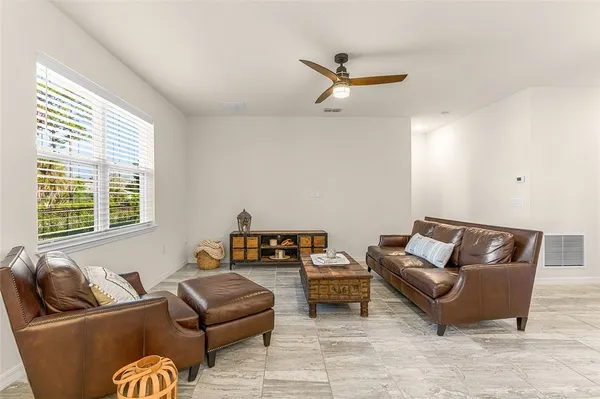 a living room with furniture and a window