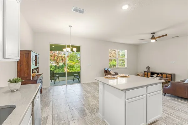 a room with a sink bed and window