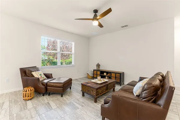 a living room with furniture and a window