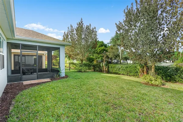 a view of a backyard of the house