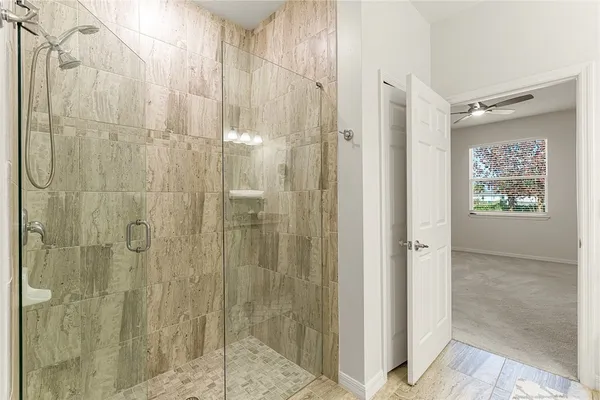 a bathroom with a shower and a sink