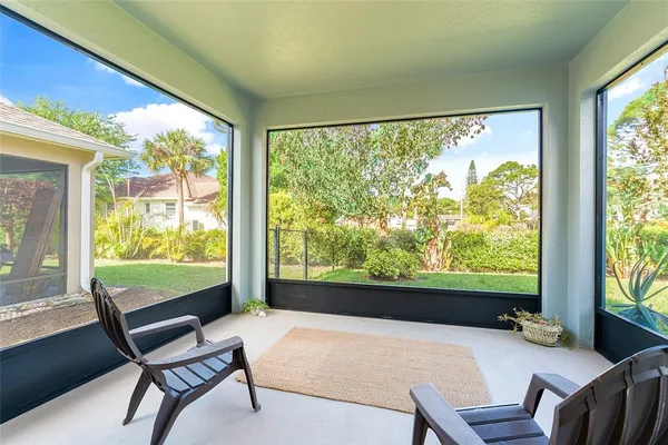 a outdoor room with chairs
