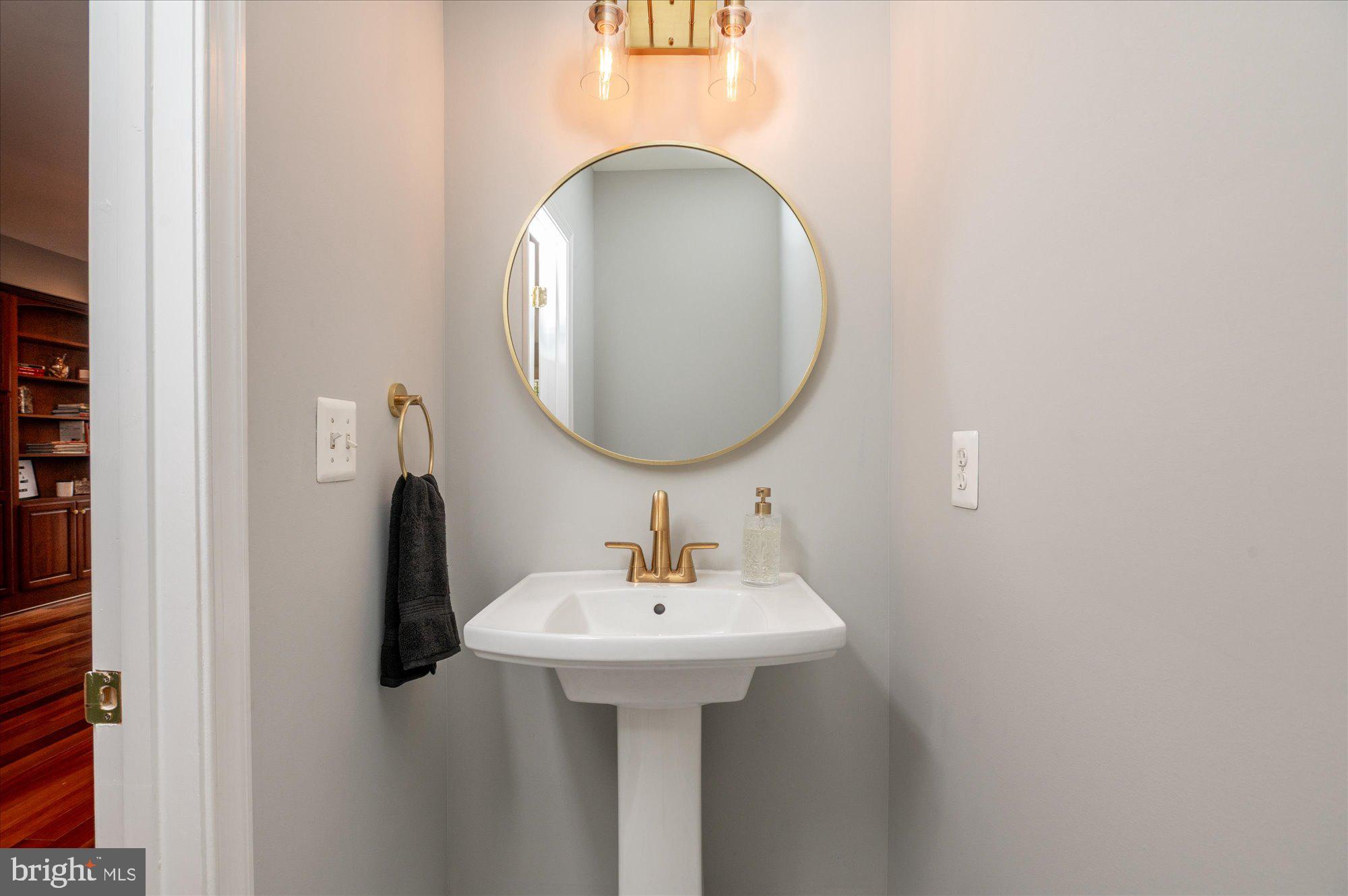 323 T Street Northwest Washington, DC 20001 - Photo 13 of 35 a bathroom with a sink and a mirror