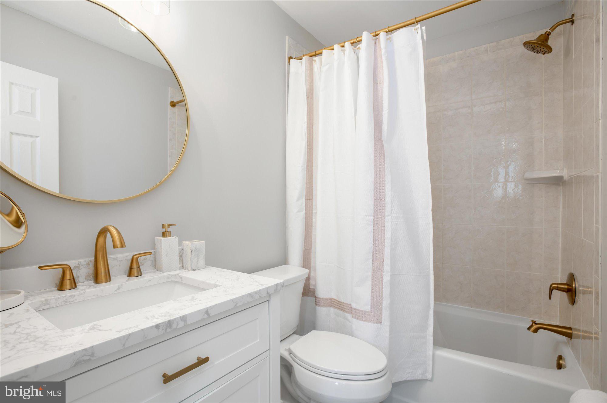 323 T Street Northwest Washington, DC 20001 - Photo 18 of 35 a bathroom with a sink a toilet and shower