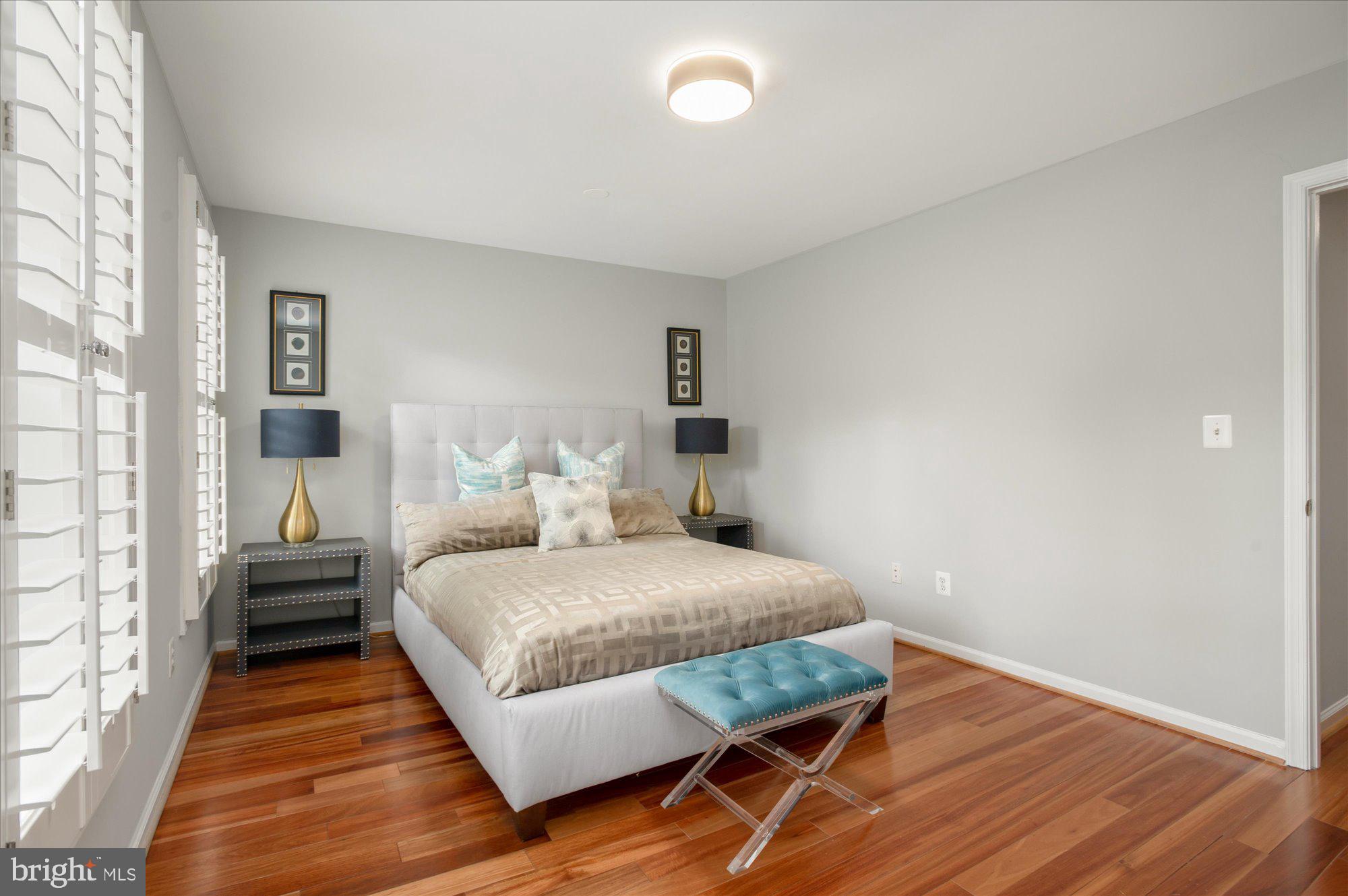 323 T Street Northwest Washington, DC 20001 - Photo 20 of 35 a bedroom with a bed and wooden floor