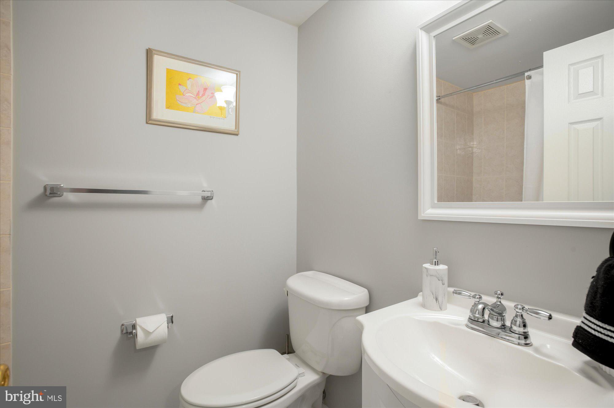 323 T Street Northwest Washington, DC 20001 - Photo 27 of 35 a bathroom with a toilet sink and mirror