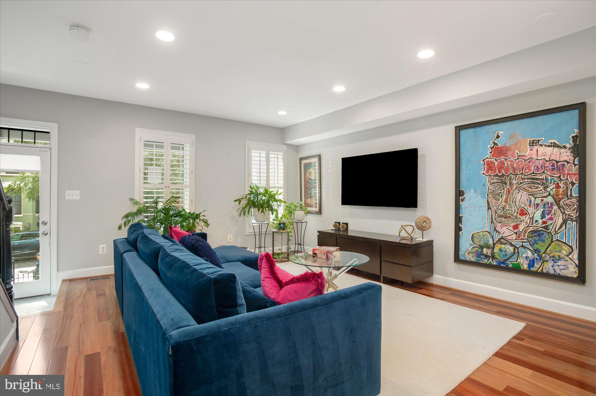 323 T Street Northwest Washington, DC 20001 - Photo 4 of 35 a living room with furniture and a flat screen tv