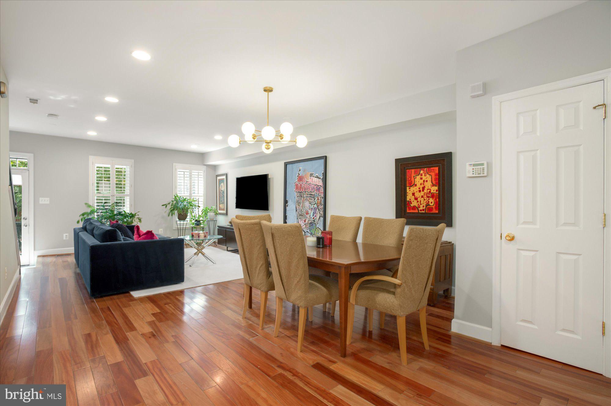 323 T Street Northwest Washington, DC 20001 - Photo 7 of 35 a dining room with furniture a chandelier and wooden floor