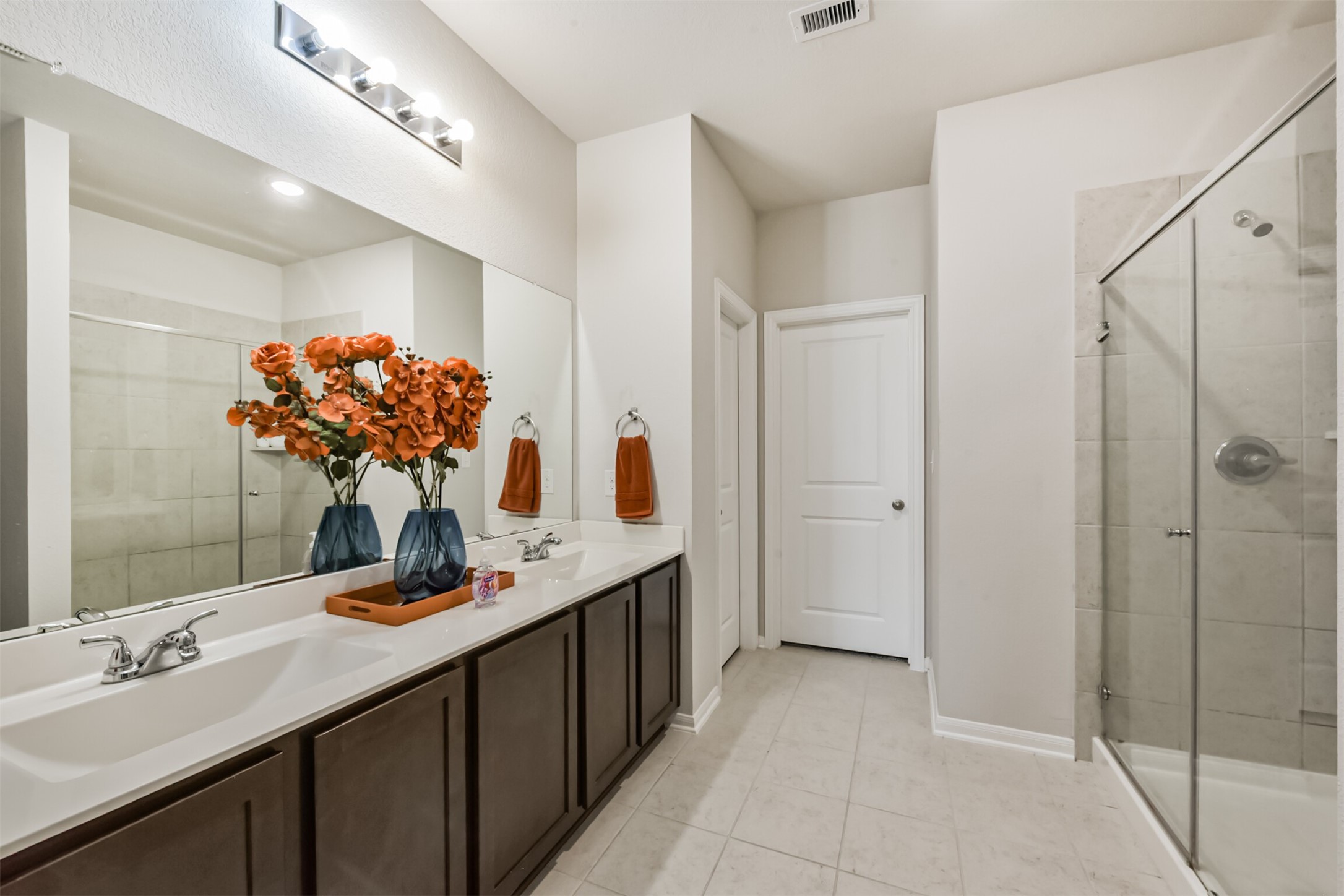 3607 Crosspointe Pass Angleton, TX 77515 - Photo 22 of 46 a bathroom with a double vanity sink mirror and shower