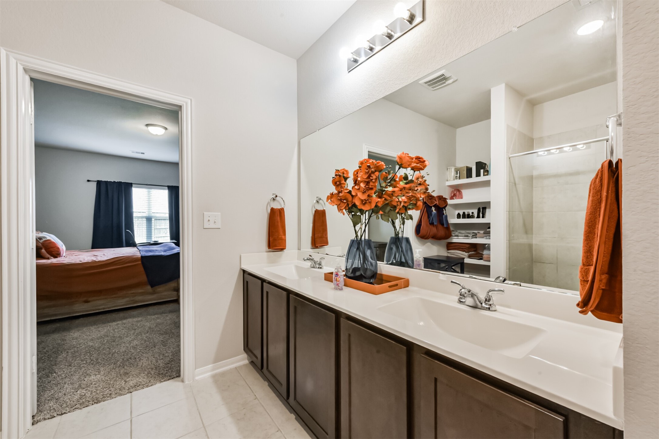 3607 Crosspointe Pass Angleton, TX 77515 - Photo 23 of 46 a bathroom with a double vanity sink and a mirror