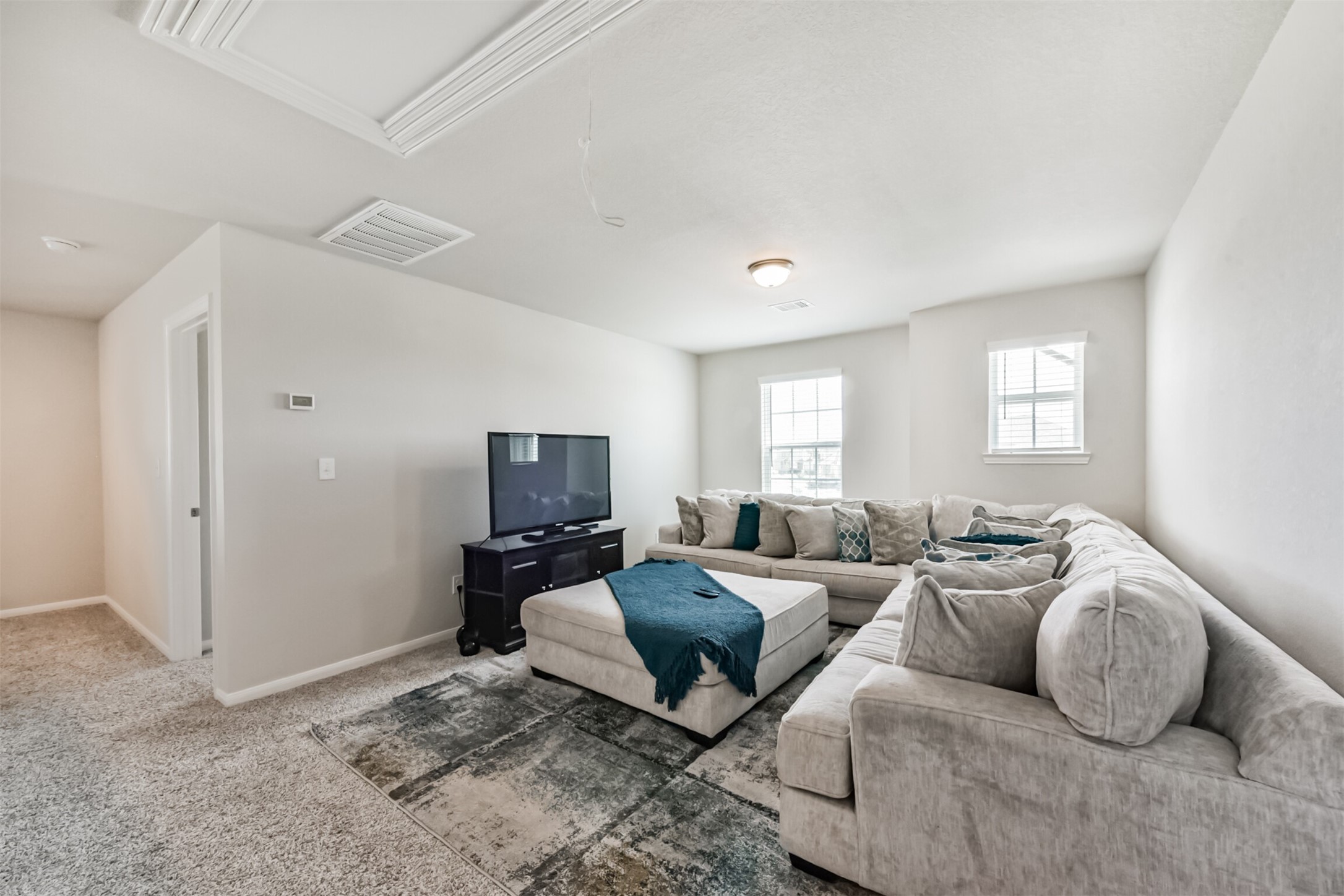 3607 Crosspointe Pass Angleton, TX 77515 - Photo 27 of 46 a living room with furniture and a flat screen tv